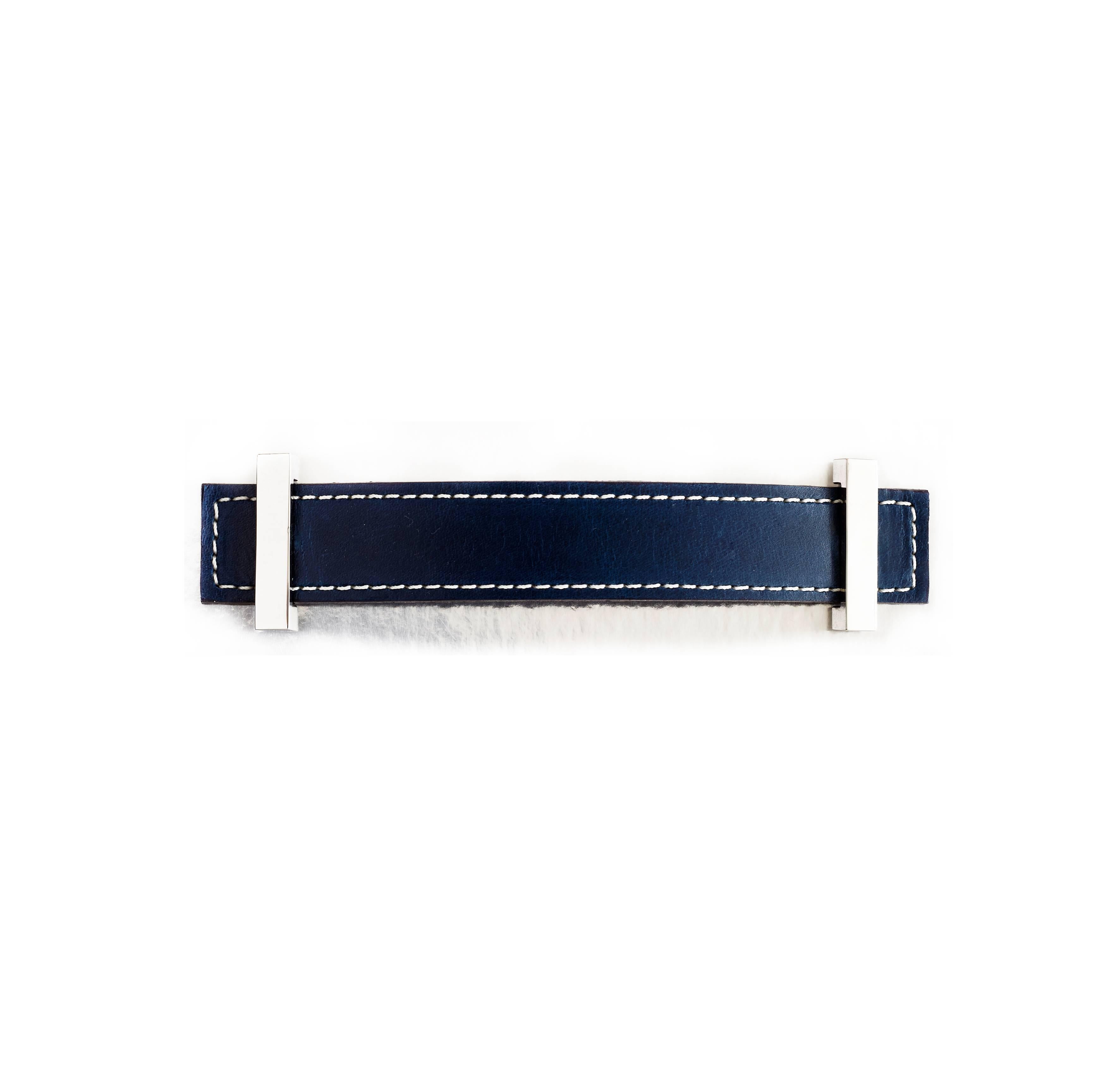 Leather strap pull with traditional saddle stitching with polished nickel end caps.