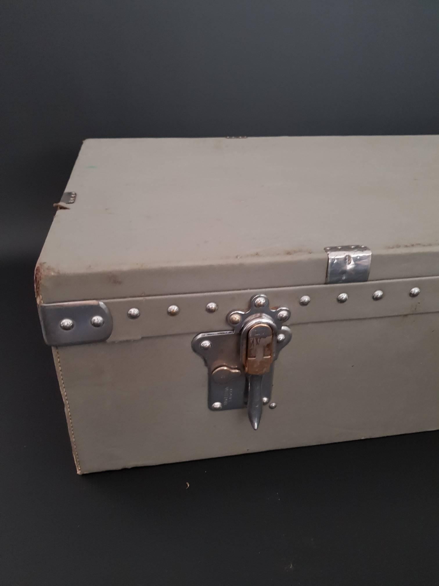 This trunk was used during the first World War to transport confidential documents. It still has the seal stamps on both ends. Has two locks and one centre latch (one lock is broken/as seen on the photos) and it has an unmarked complete