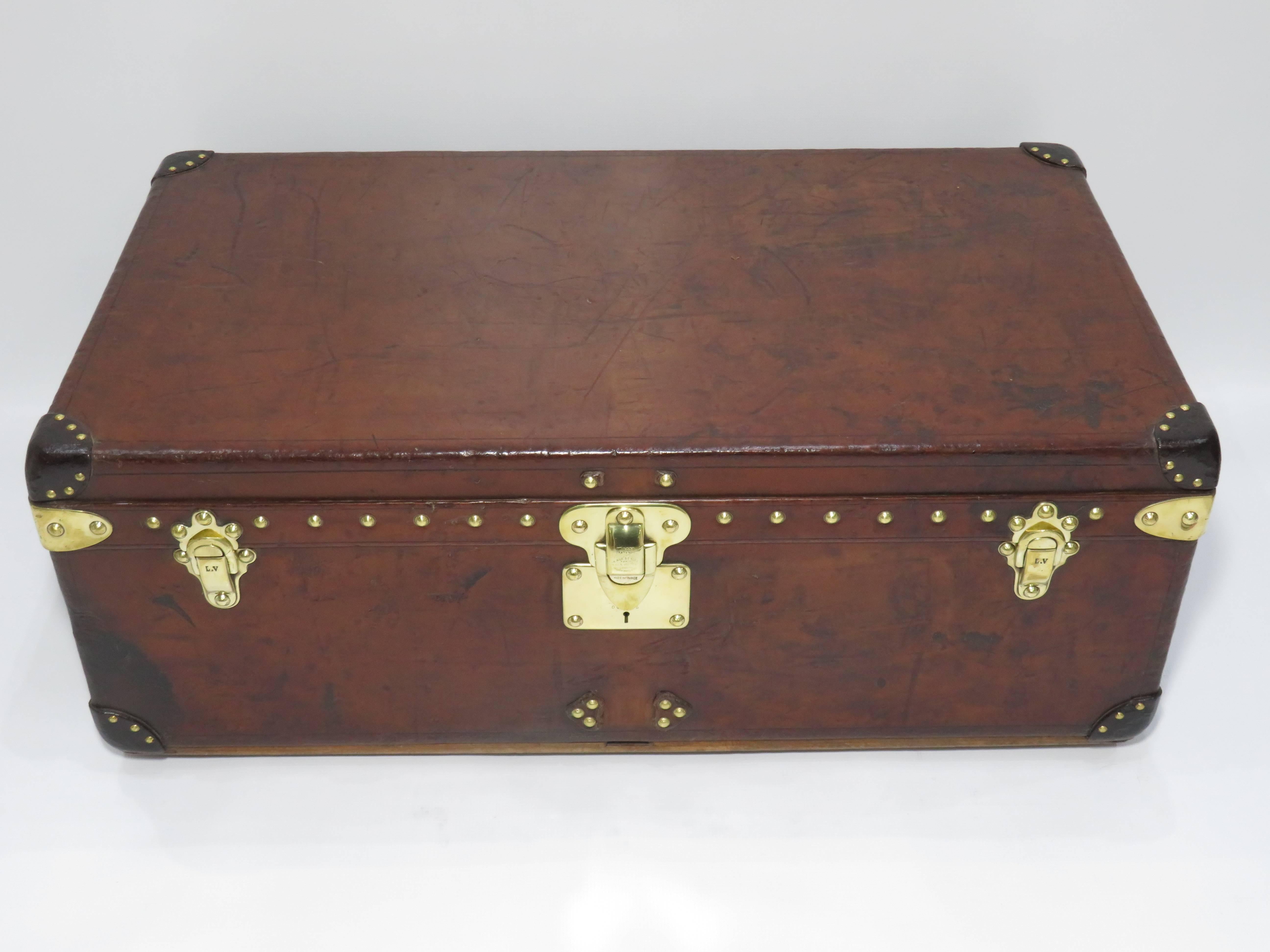 Early 20th century Louis Vuitton cowhide leather cabin trunk with a very nice patina, brass hardware and very clean interior.
Perfect size to be used as a coffee table.