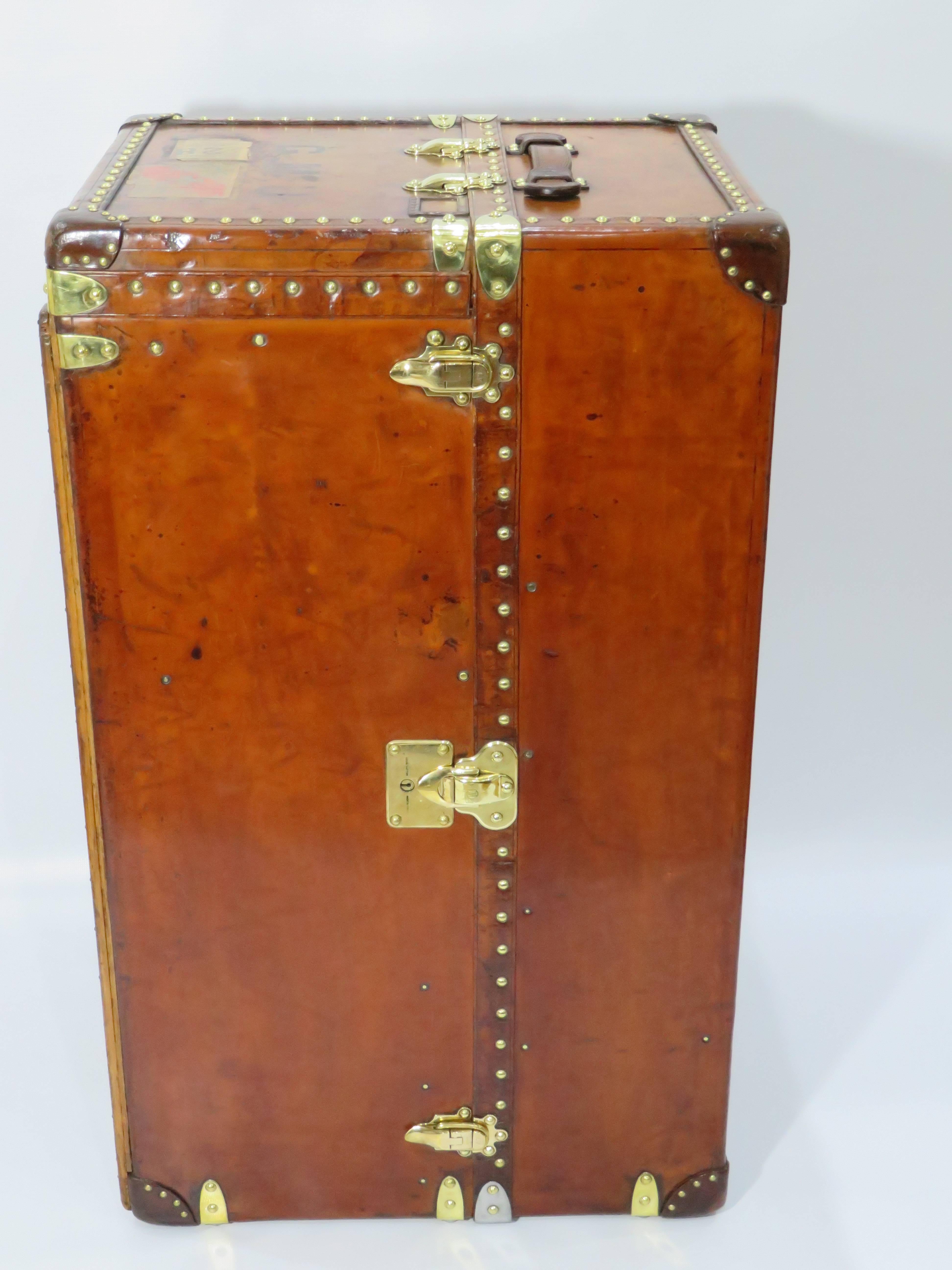 For sale a collector's item, a complete early 20th century Louis Vuitton leather wardrobe, with a 100% complete interior, finished in cowhide leather with brass details. 

This is the biggest size wardrobe LV ever made and not to be compared with