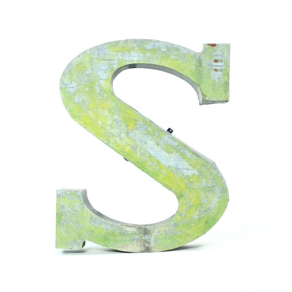 Strong yet beautiful. This Industrial sign of S letter has lots of vintage charm. Originally used as a part of factory sign, the S letter is completely made of a shaped sheet metal. Original condition with lots of original green paint showing. Some