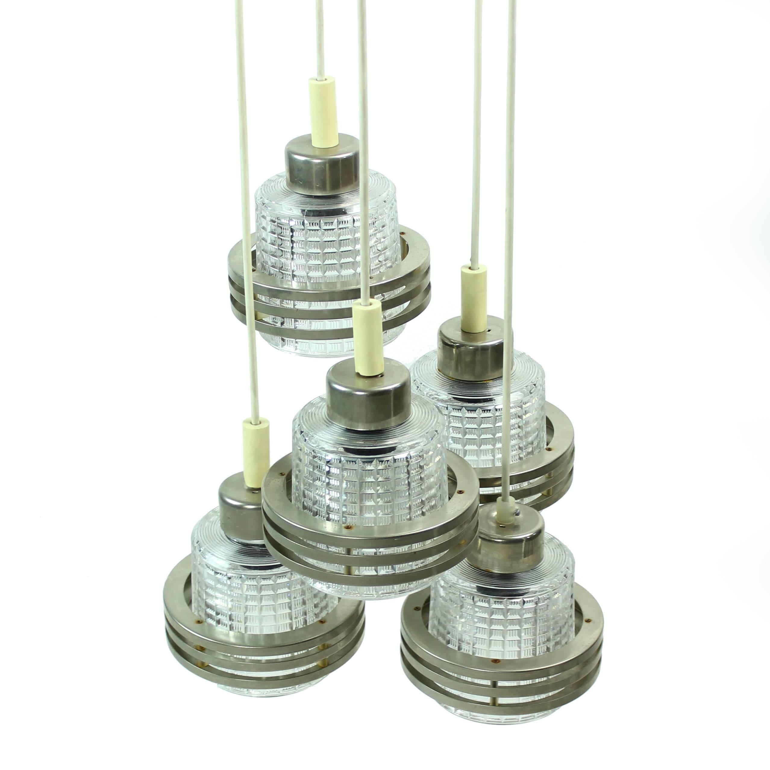 Ceiling pendant with five hanging lights. Each made of chrome metal and pressed glass. Stylish and elegant combination that never goes out of fashion. Very good condition.