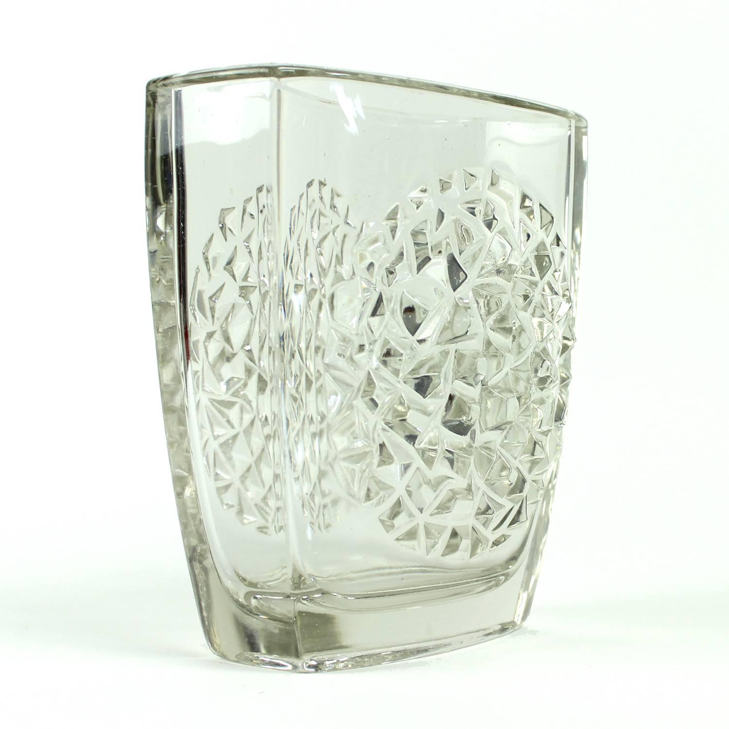 Iconic jardiniere designed by Rudolf Jurnikl for Rudolfova hut glass union in 1964. Made of pressed glass, the item weights over 1 kilo. Unique and beautiful clean glass item for real lovers of Czech glass making tradition and design.