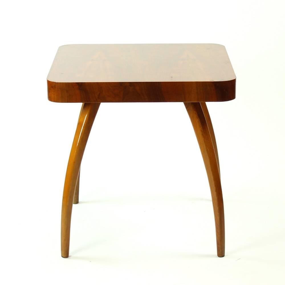 The unique style of this table is recognized all over the world. Designed by Jindrich Halabala, the spider table stands on four ôegs of bentwood. Massive top board adds to the unique style of this item. Beautiful condition after restoration to its