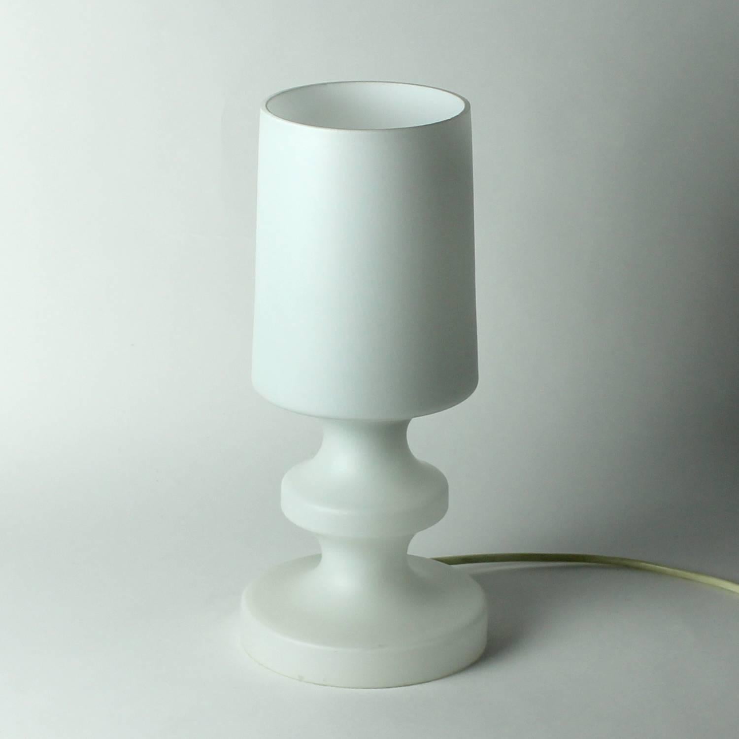 Beautiful and unique table lamp made of matte, pure white triplex opal glass. Designed by Ivan Jakes for Osvetlovaci Sklo company in Czechoslovakia in 1970s. This unique model is not only a very beautiful lamp with lovely and soft light, but also a