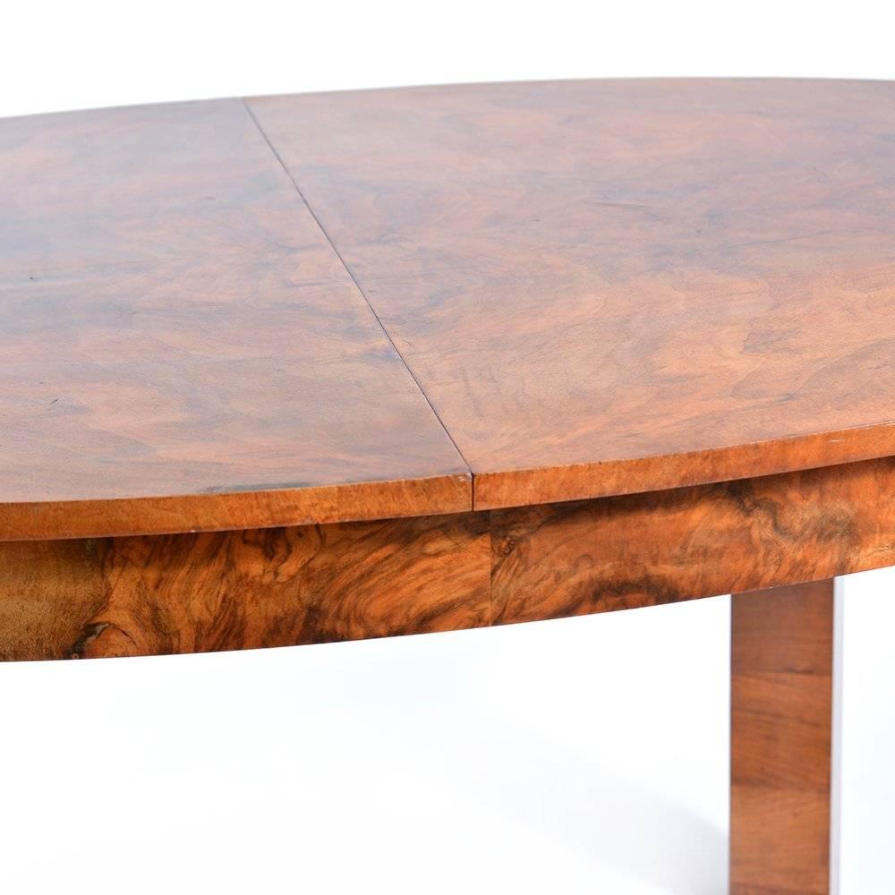 Large oval fold out Art Deco dining table in beautiful finish and lots of elegant details. Made of hard wood with beautiful walnut veneer finish. Table easily sits eight people. When folded out it is 229cm long. Beautiful, very good condition with