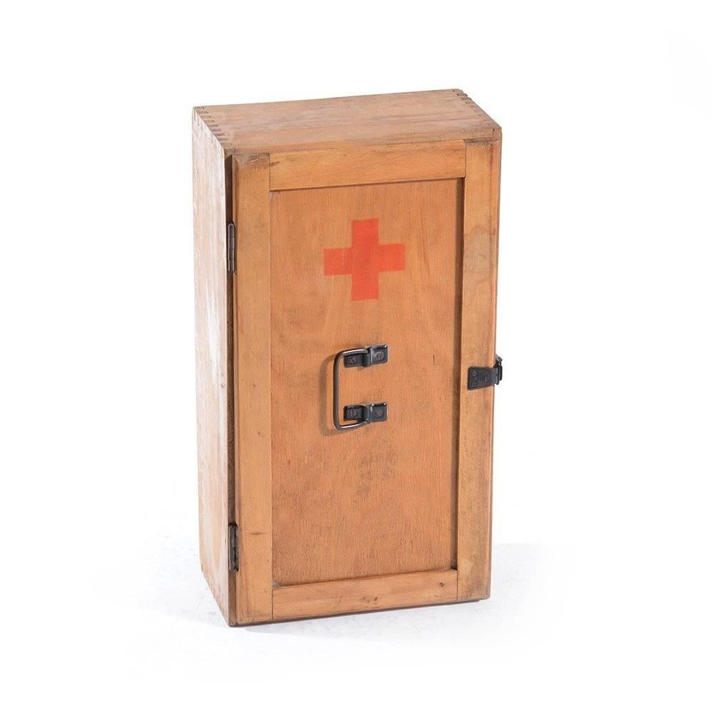 First-aid cabinet or a case, originally used at school for the first-aid presentation. Now a stylish addition to any modern home, can easily be used as a small cabinet in an office or hallway. Shows signs of use, however the patina just complements