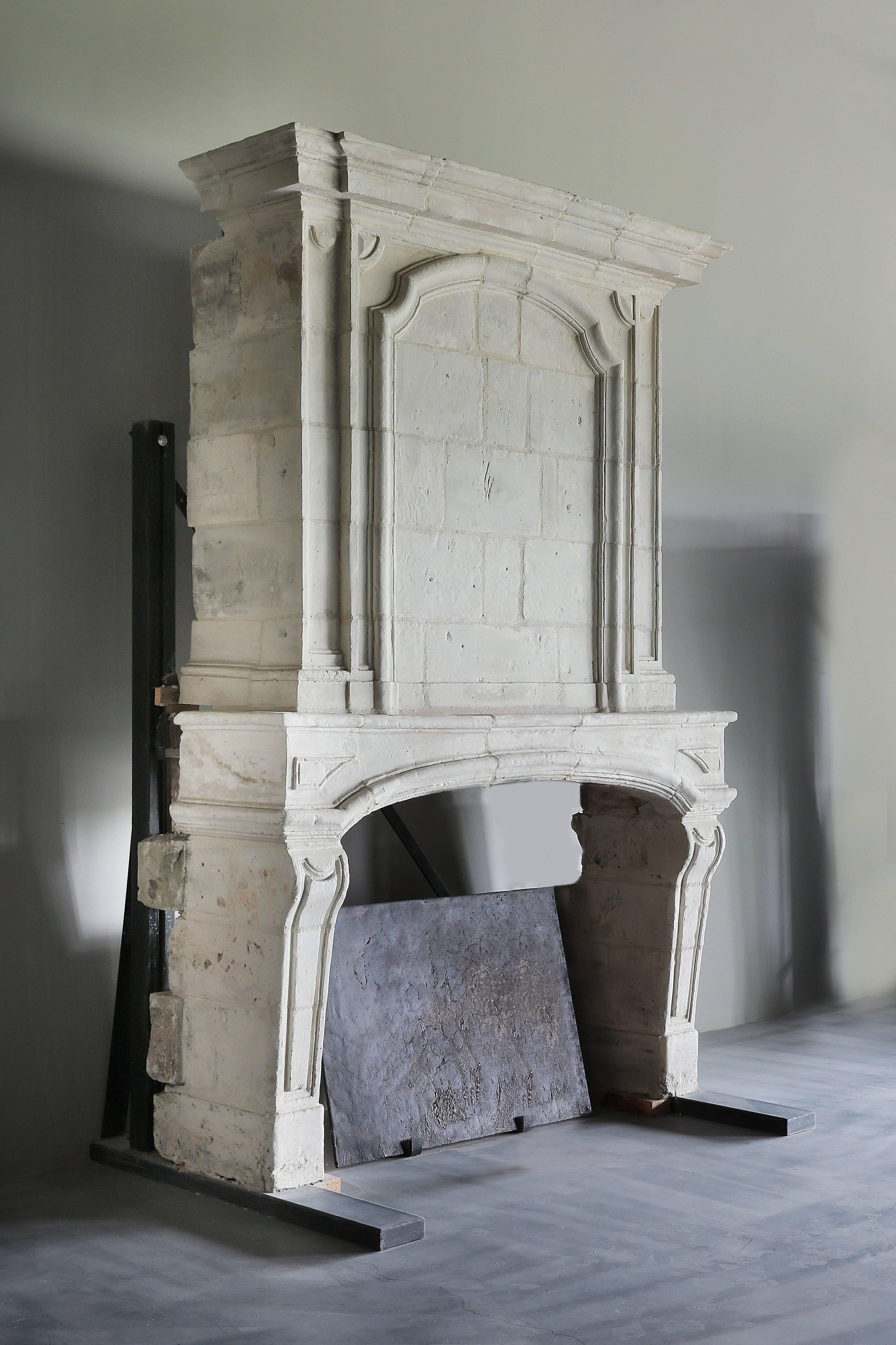 Very charming castle fireplace of limestone in the style of Louis XIII.