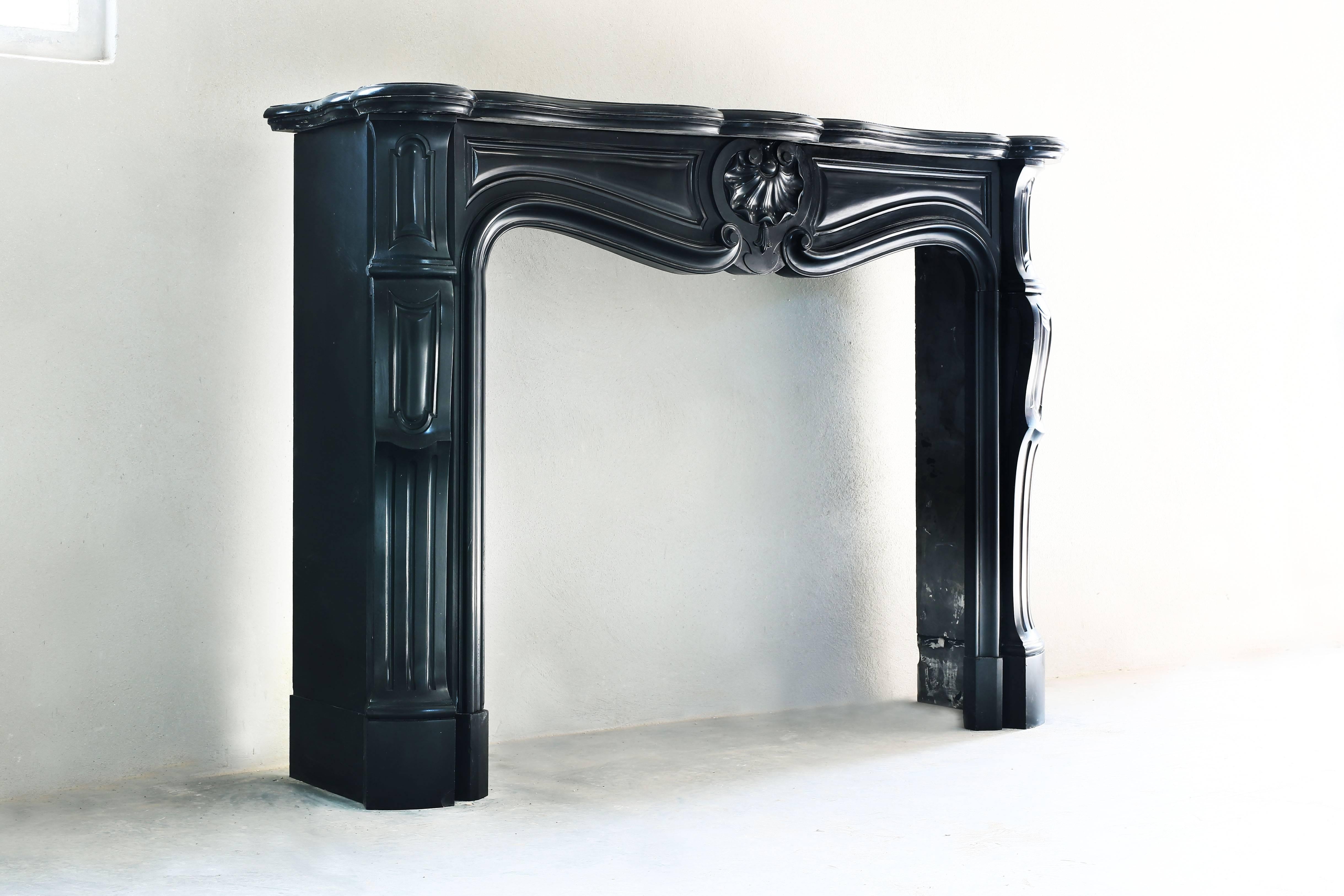 Antique Noir de Mazy fireplace from Belgium. Very nice of the ornaments, black color and graceful form.