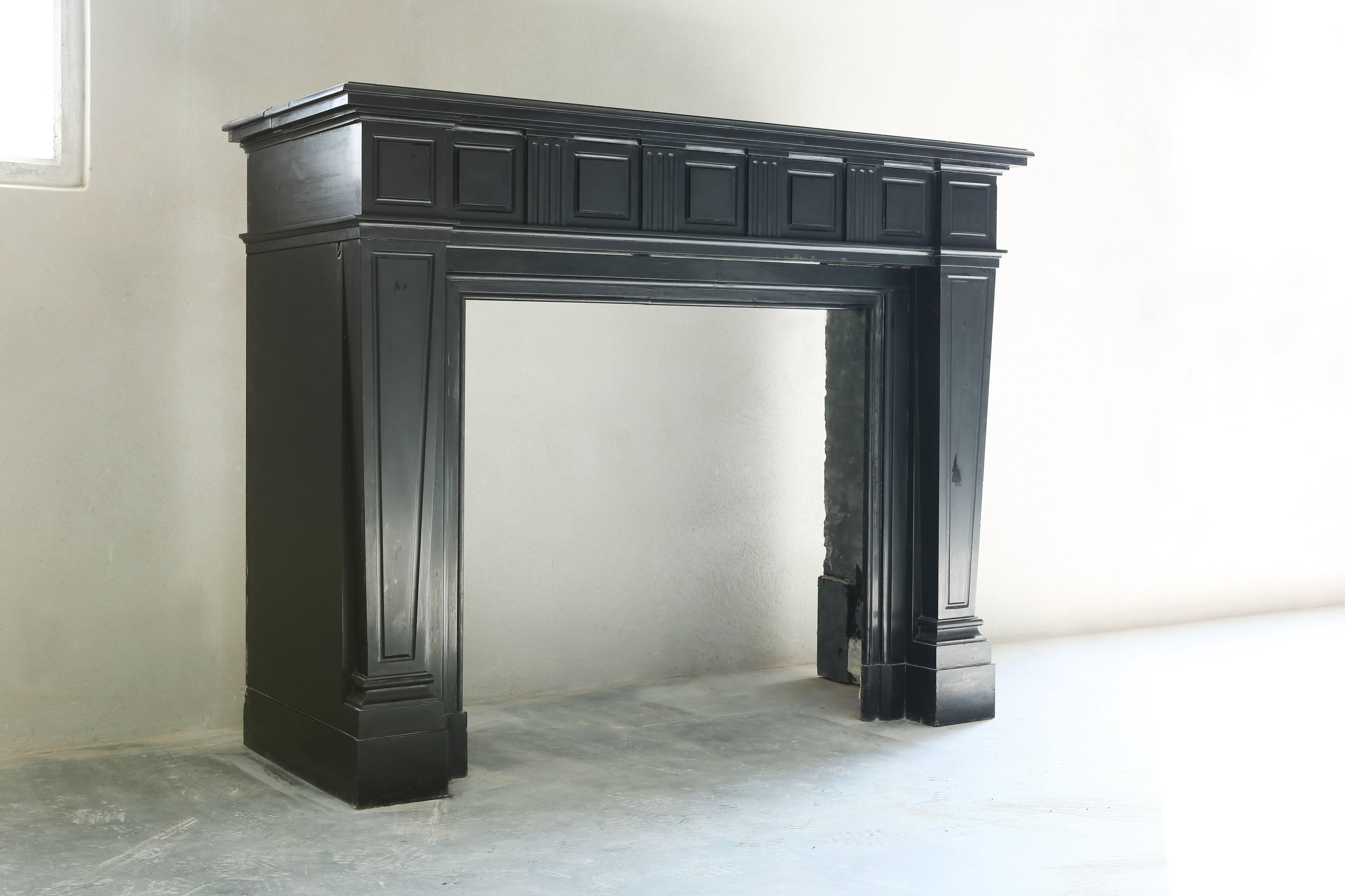 A very unique and beautiful antique fireplace of black marble. We found this fireplace in Belgium. It's from the era of King Louis XVI.

 