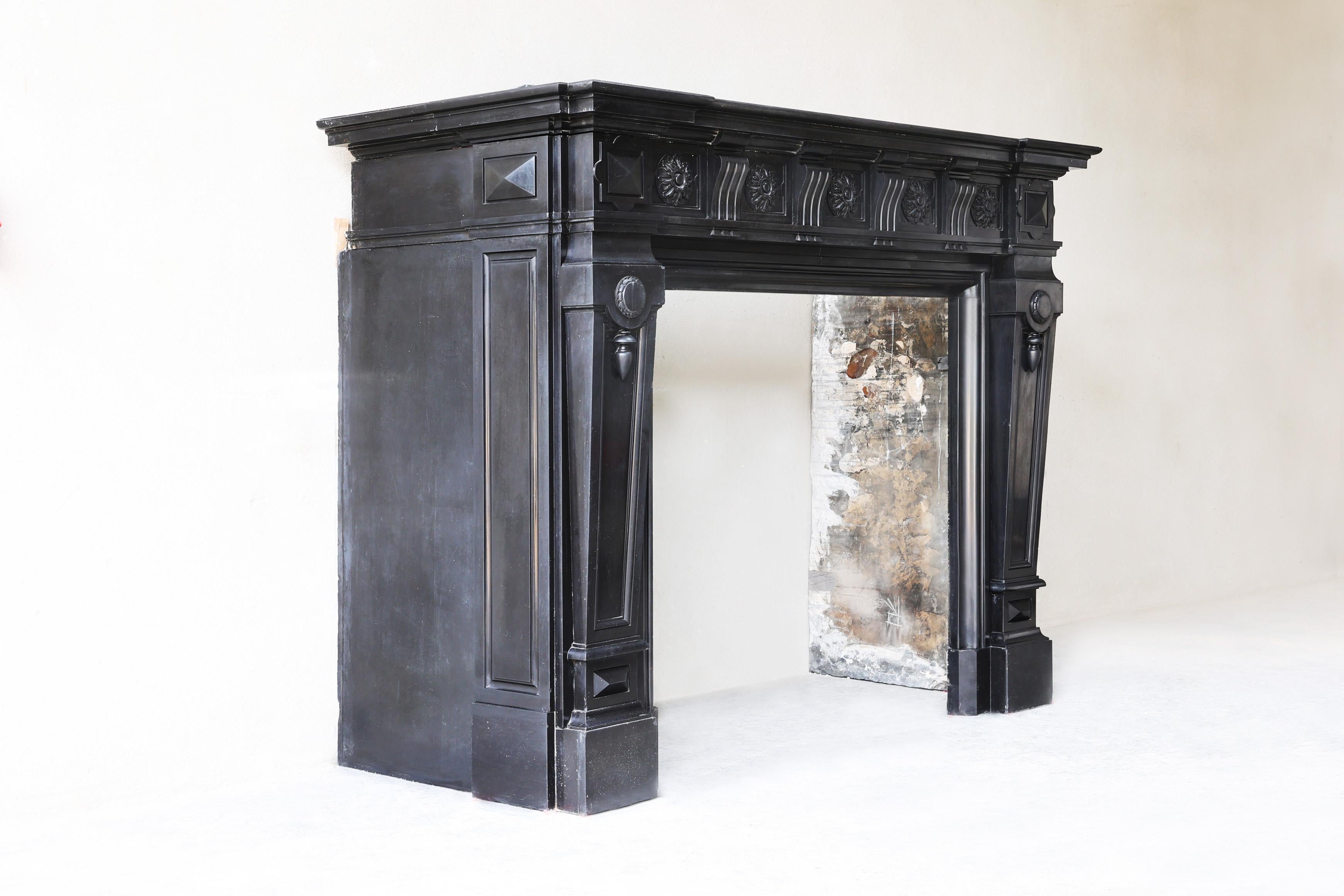This exceptional 19th century mantelpiece, made from the rare Noir de Mazy marble, exudes the refined elegance of the Louis XVI style. With its rich black glossy surface and refined details, this is a true showpiece. The clean lines and classic