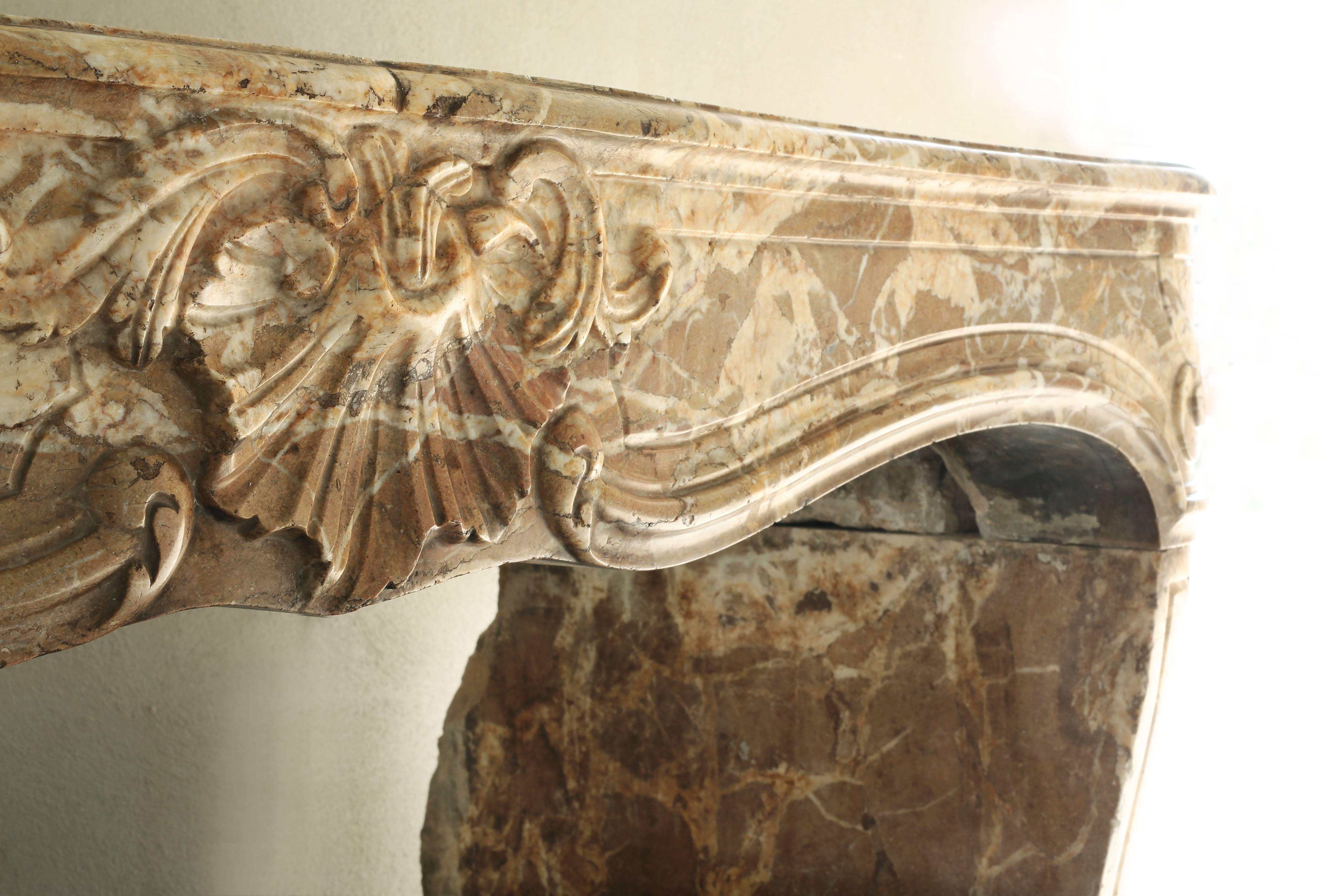 This very unique fireplace is made of solid marble and dates back to the late 17th century! A very unique fireplace of its kind. The marble species is 'jaune di sienna'. The grooves from which this marble has been reached are now closed. The