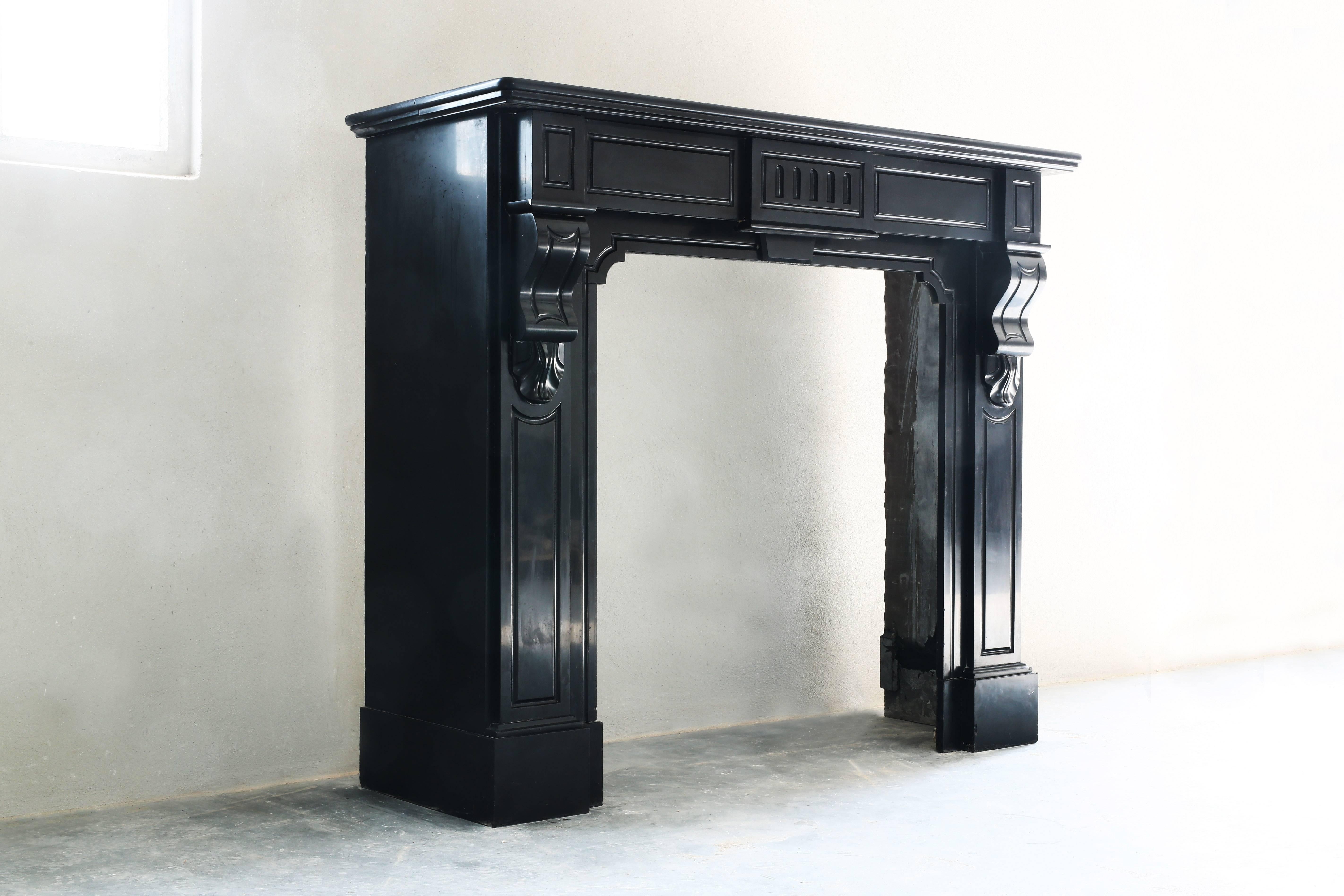 A very unique and beautiful antique fireplace of black marble 'Noir de Mazy'. We found this fireplace in Belgium. It's from the Empire style!

 