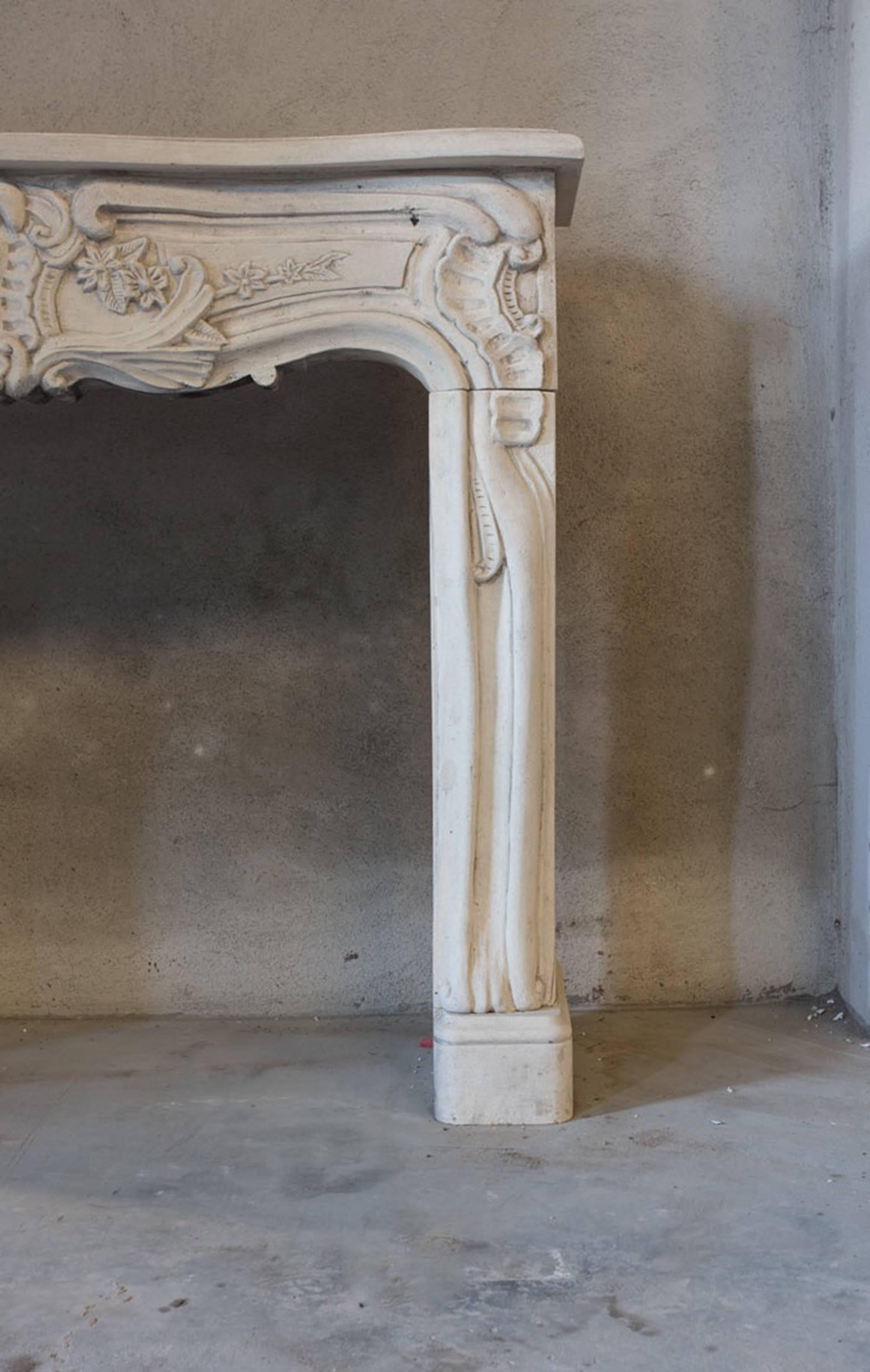 French 19th Century Ornamental Limestone Fireplace in Louis XV Style