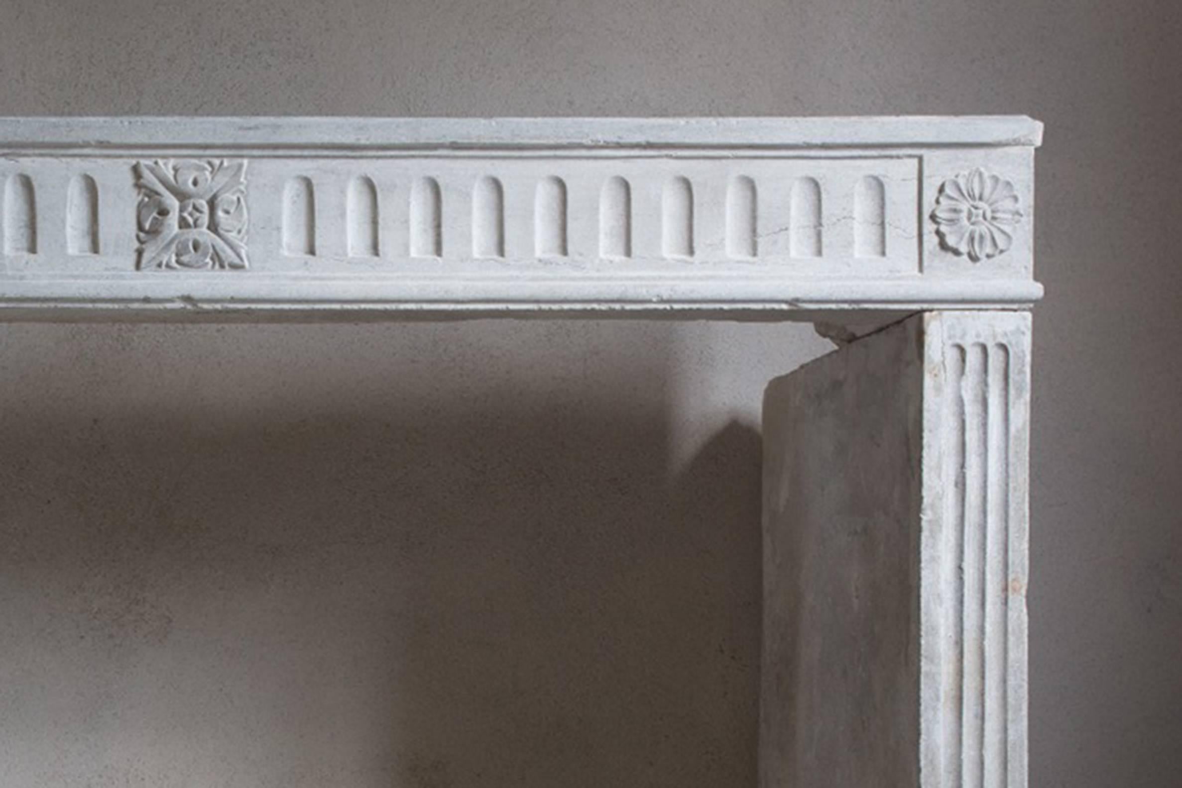 Nice antique fireplace of limestone in the style of Louis XVI.