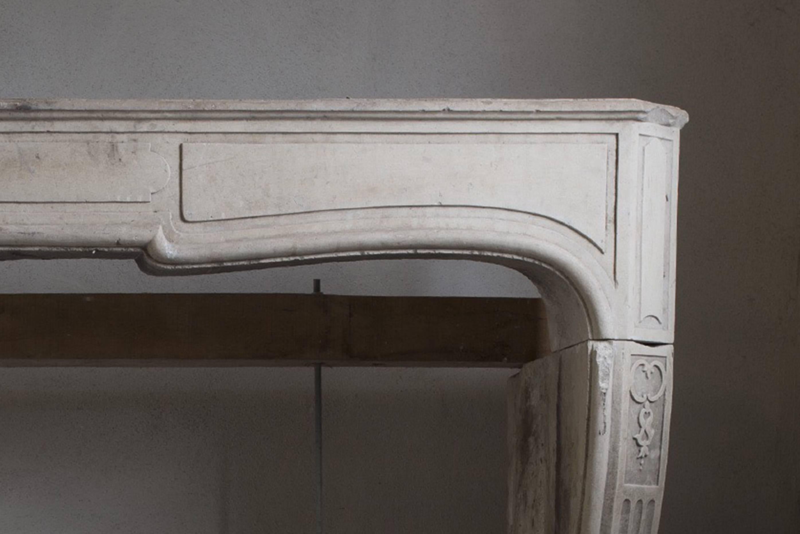 Discover a Timeless Masterpiece: Our 19th Century French Antique Limestone Fireplace. Immerse yourself in the elegance of the past with this exquisite, hand-carved masterpiece from 19th century France. Crafted in luxurious limestone, this fireplace