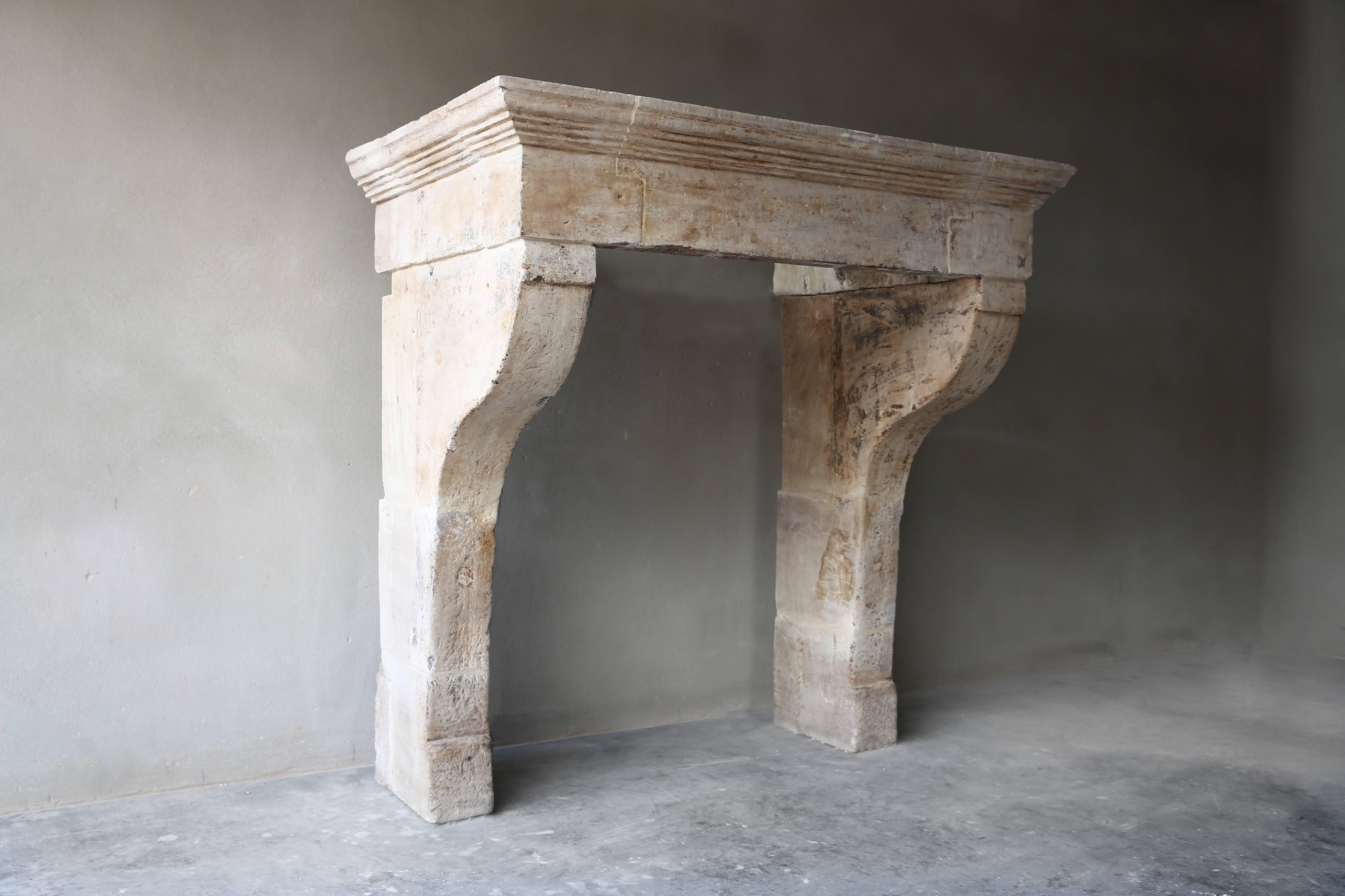 Very nice antique fireplace of limestone from the 18th century in the Campagnarde style.