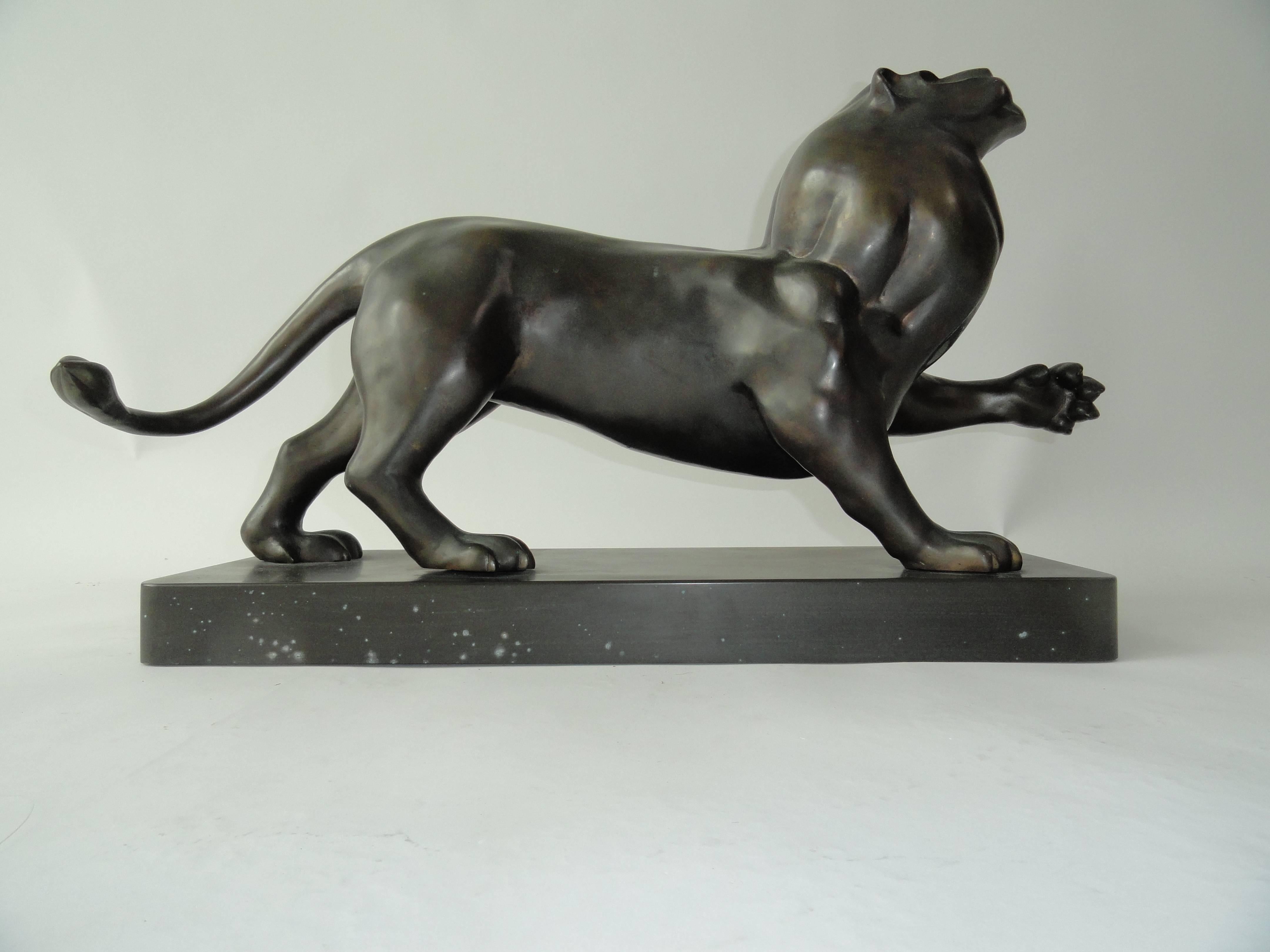 Signed Estevez by Robert Estevez, lion in bronze. Sculpture designed for Karl Springer, New York. Model based on Pierre-Jules Mene's bronze animal sculptures of the 19th century.