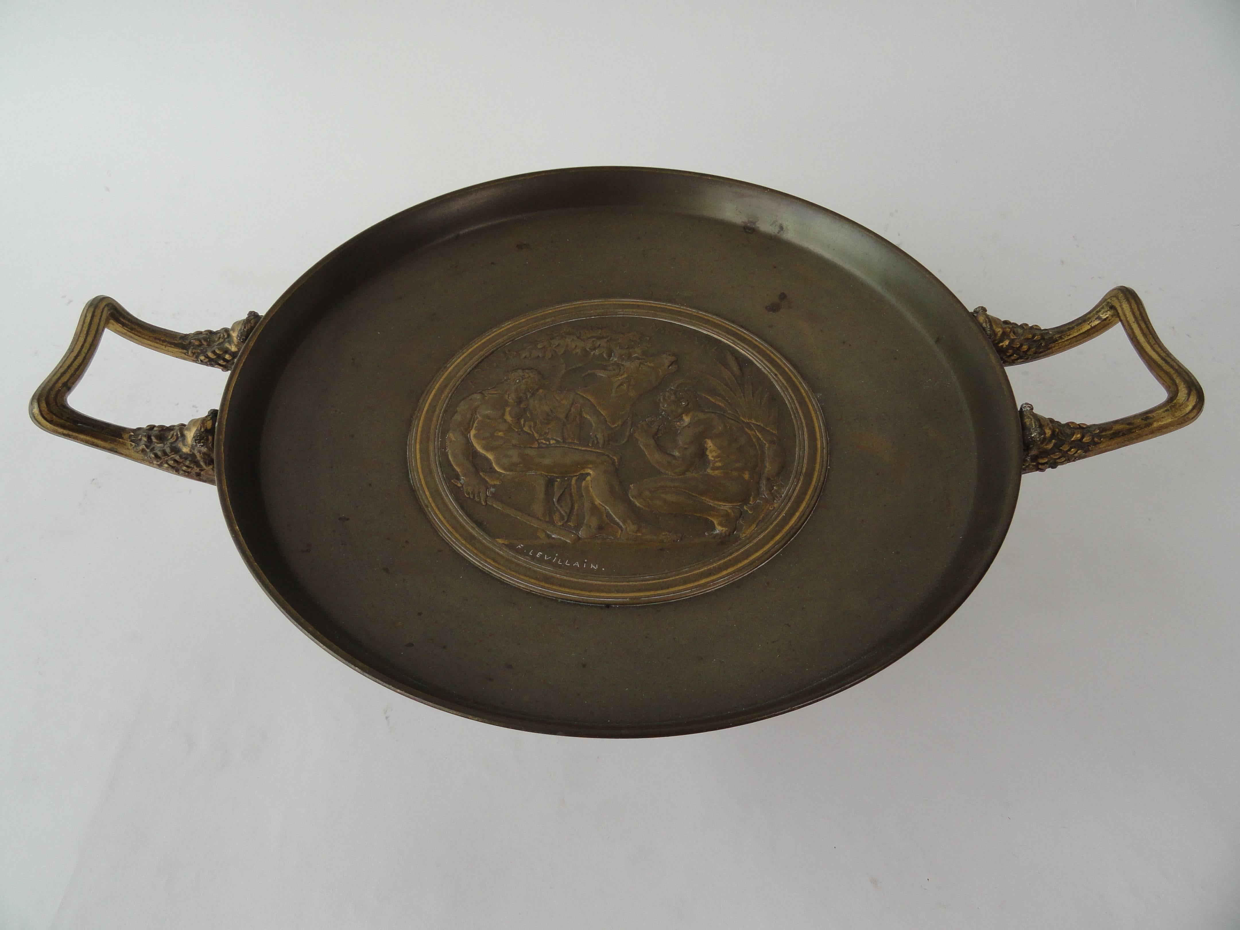 Ferdinand Levillain (1837-1905) & Ferdinand Barbedienne (1810-1892), bronze tazza, 19th century, French.
Designed by Levillain and signed in the casting, marked F. Barbedienne, on underside of tazza. Large, round centerpiece, in the center with a
