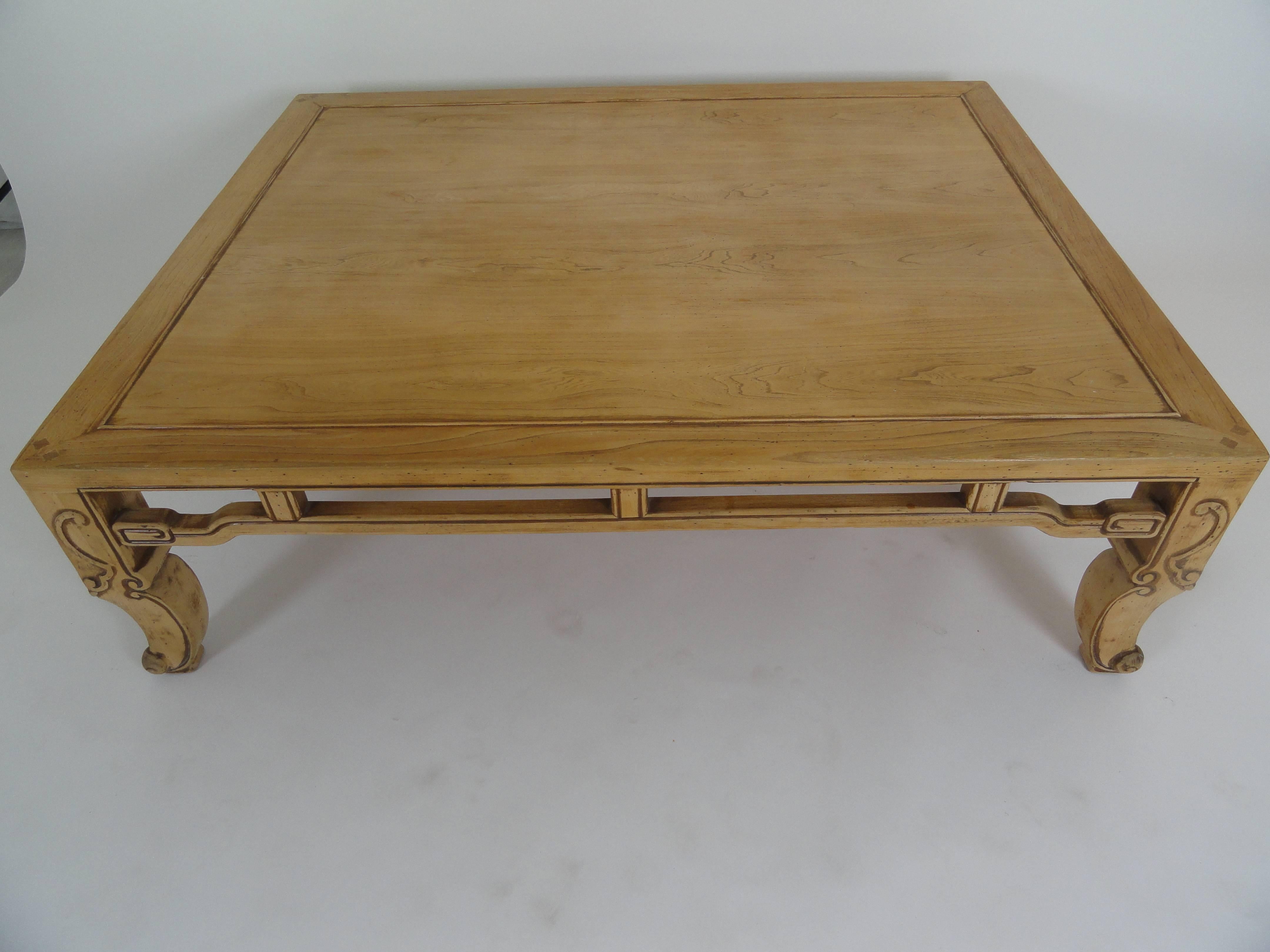 Baker Ming style coffee table in natural wood finish with detailed carving. 
Baker tag on bottom.