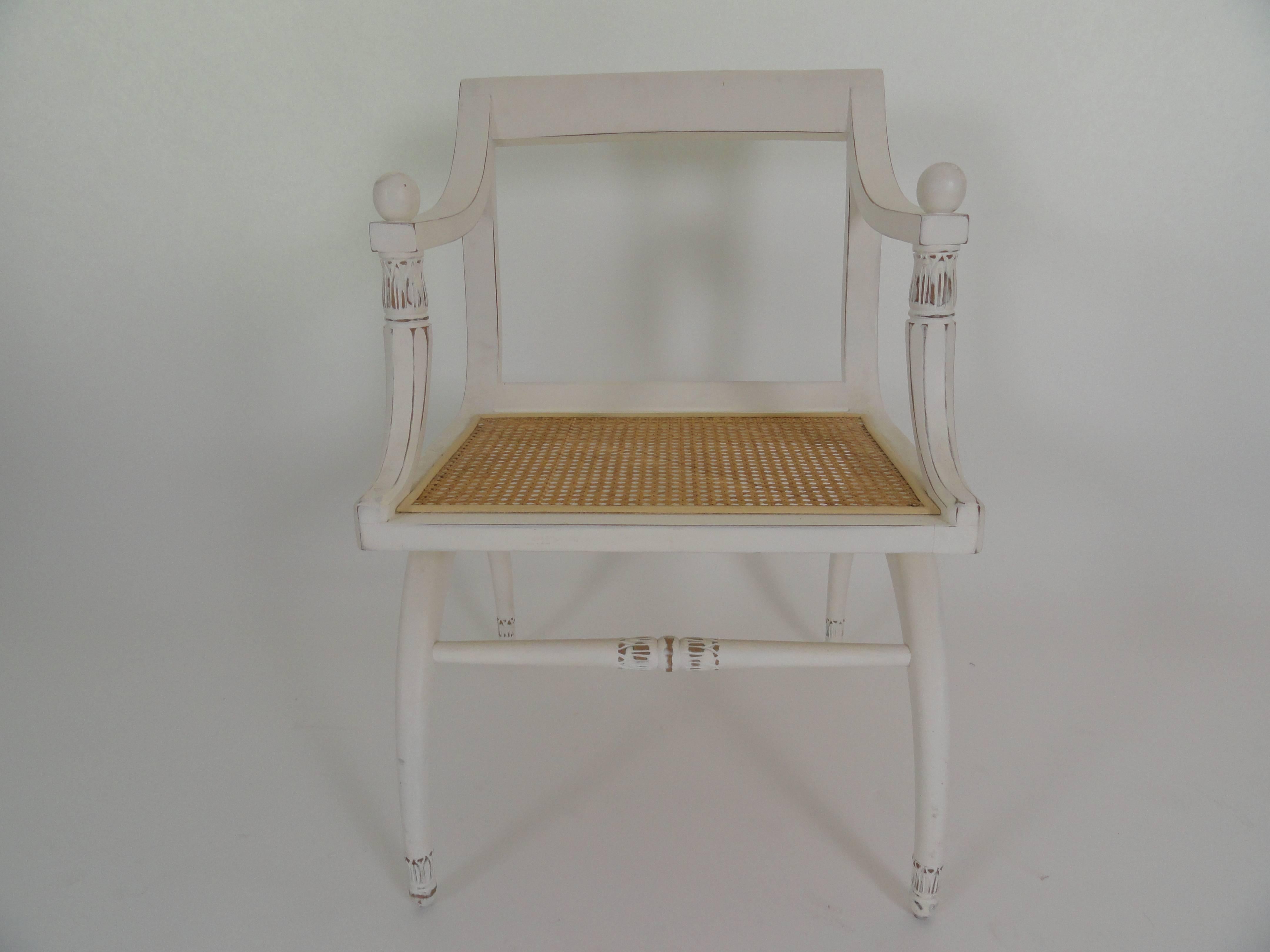English Regency style cane chair with newly caned seat with white, lightly distressed finish.