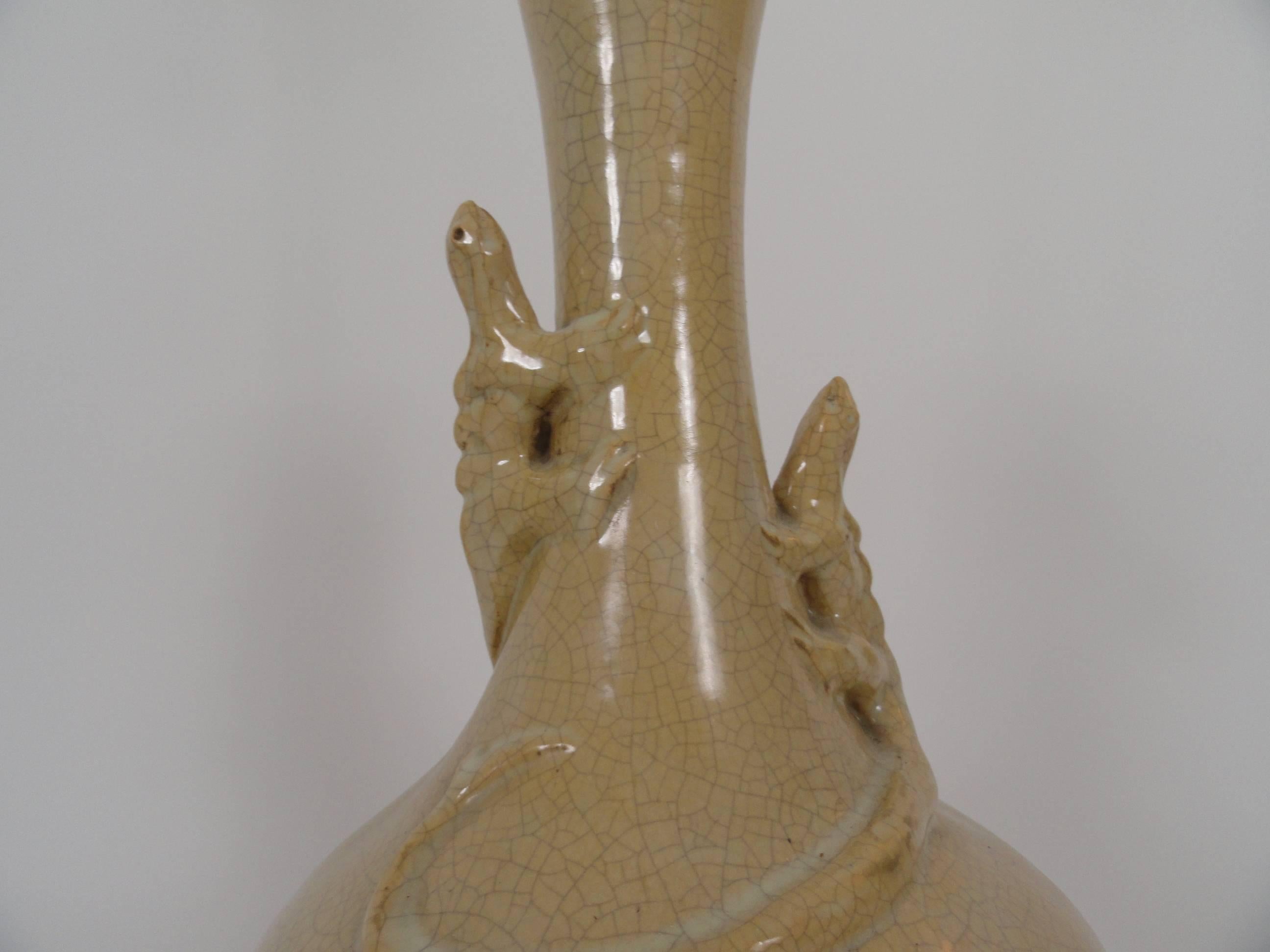 19th century Chinese ceramic lamp with applied lizards. On custom wood base.
Wired with inline switch. 
 