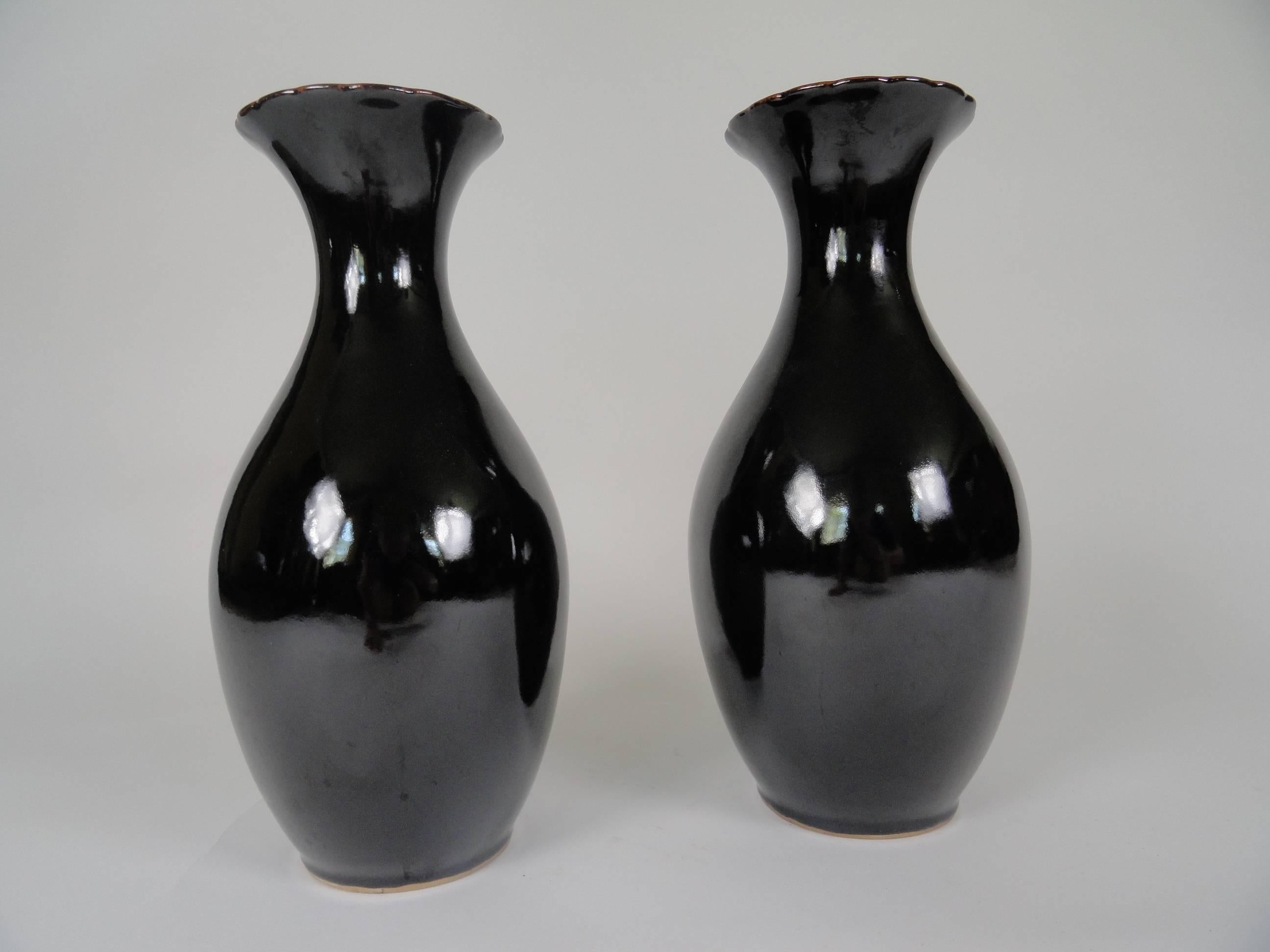 Pair of tete de negre ceramic vases, late 20th century with glazed finish.
Made in China
One vase is slightly taller (approximate .75 inches).