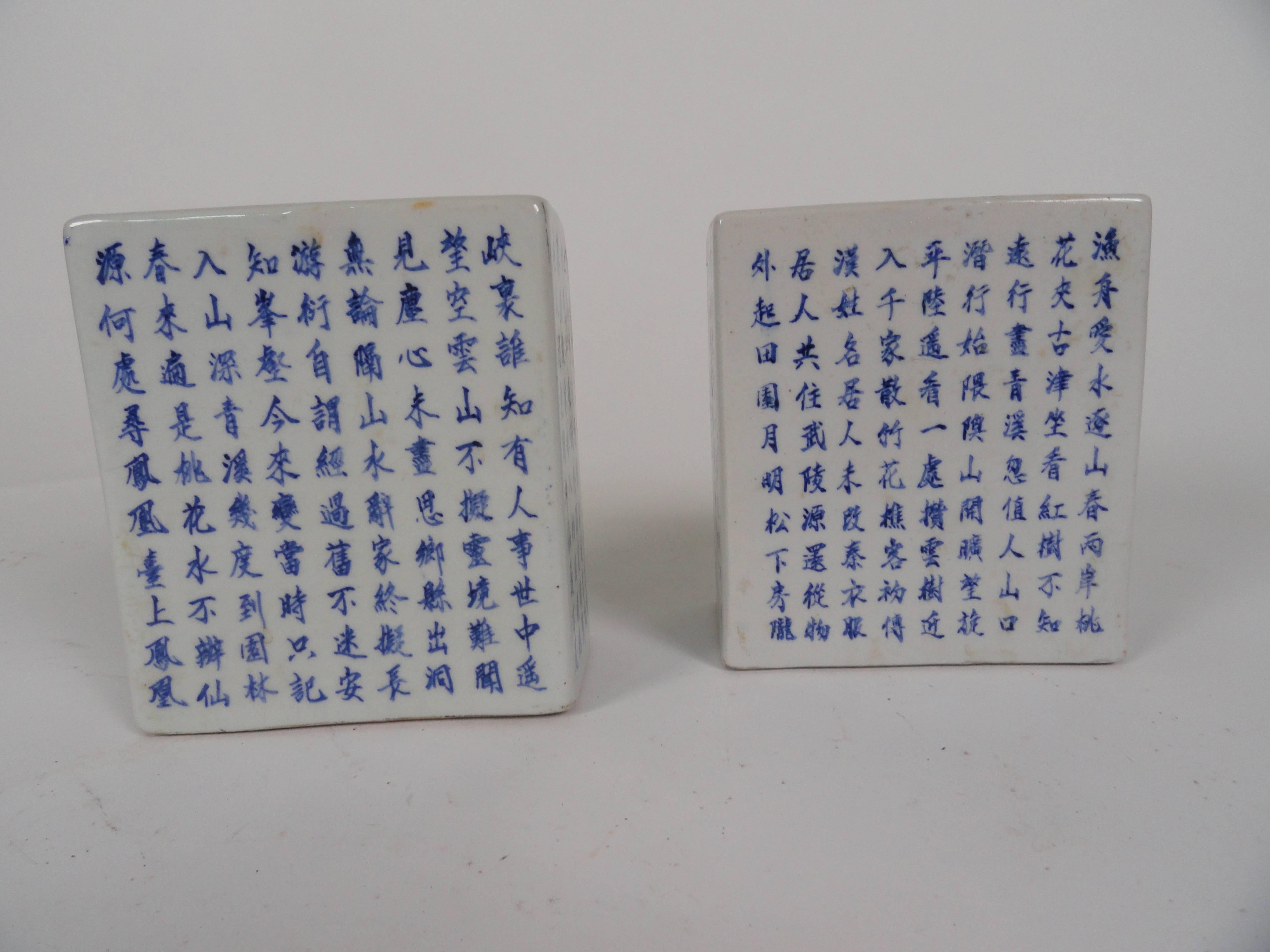 Pair of 19th century oriental ceramic scholar boxes with an off-white finish and characters in blue on all sides. 
Scholars boxes may have been used as pillows. Rare and unusual.