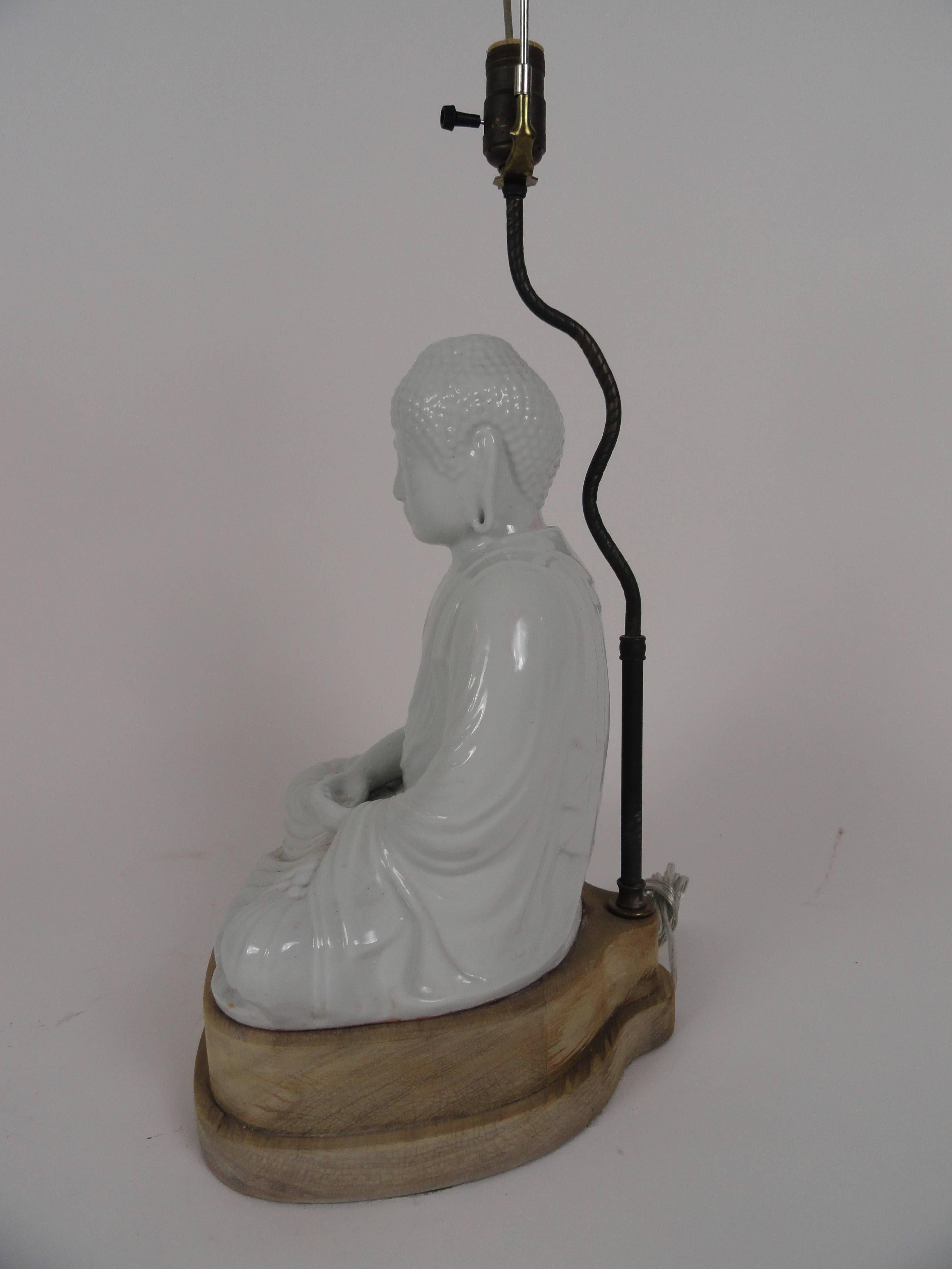 20th century Blanc de Chin Buddha lamp on natural wood pedestal. Art wired.
 