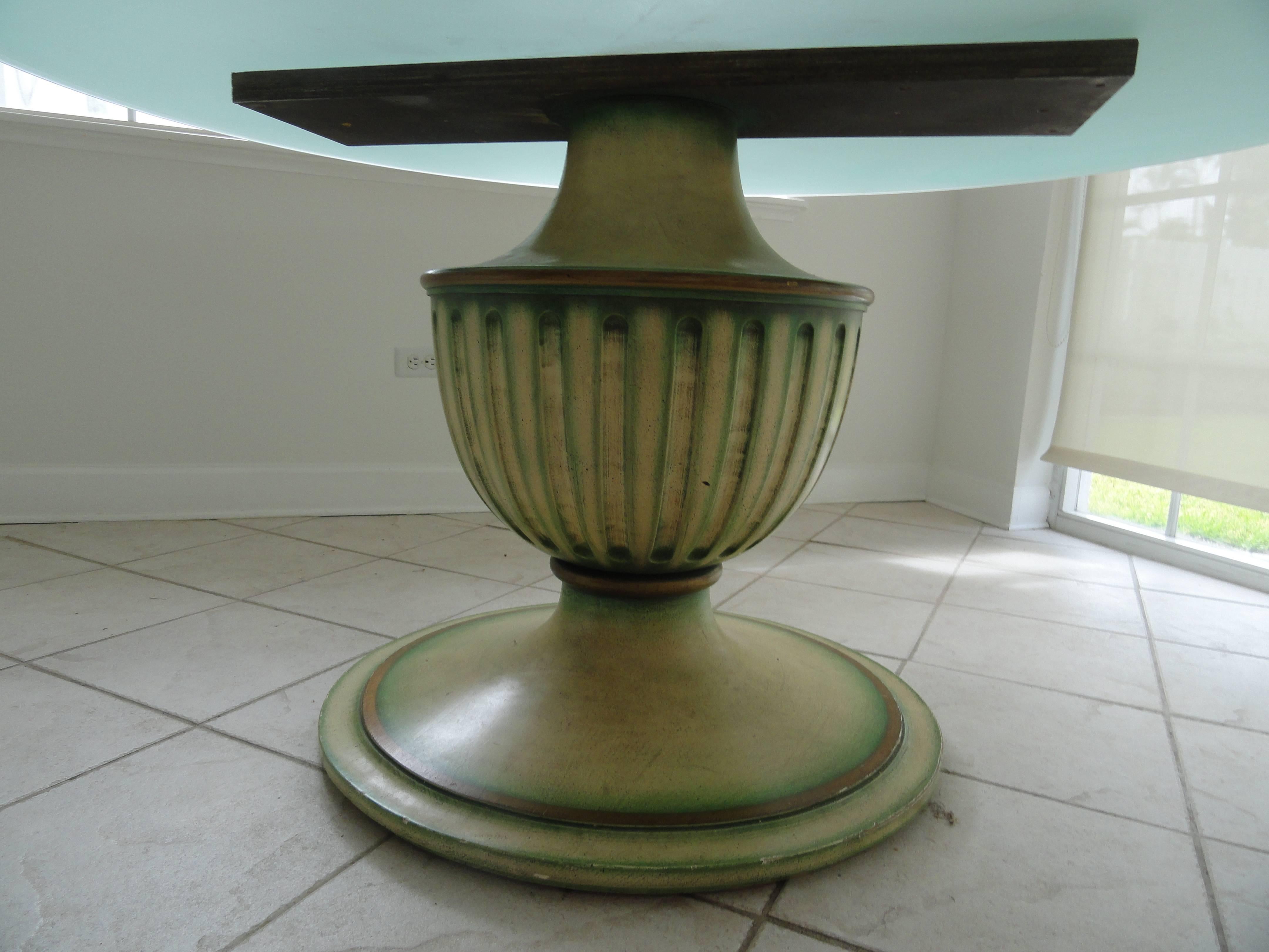 20th century wood table base painted in tones of green and gold. Classic urn base. Shown with 59" sand blasted glass top. Actual base is 30" diameter.
Pair available.