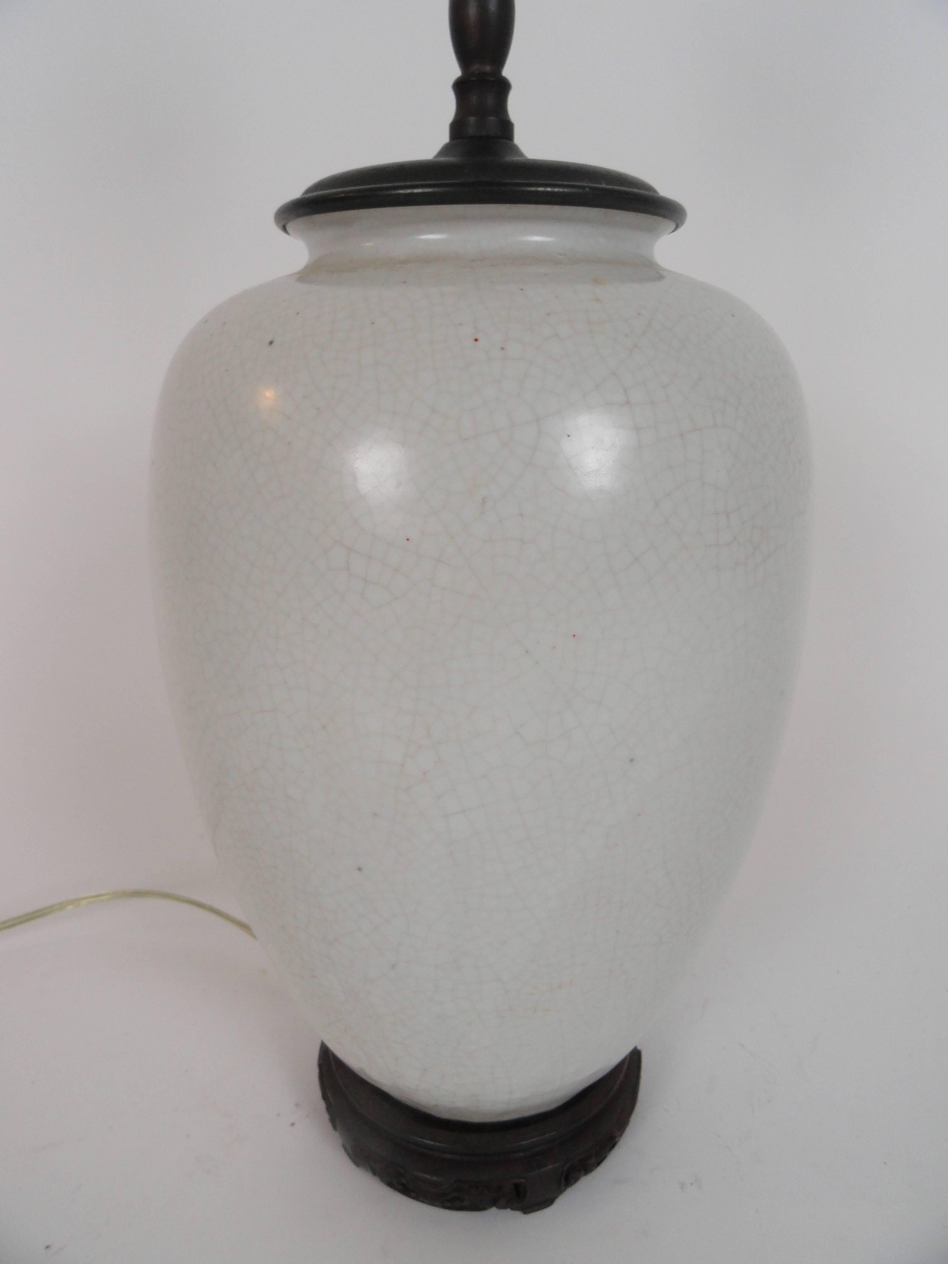 Oriental white crackle lamp featuring a wabi sabi finish, early 20th century. On custom teak base.

  