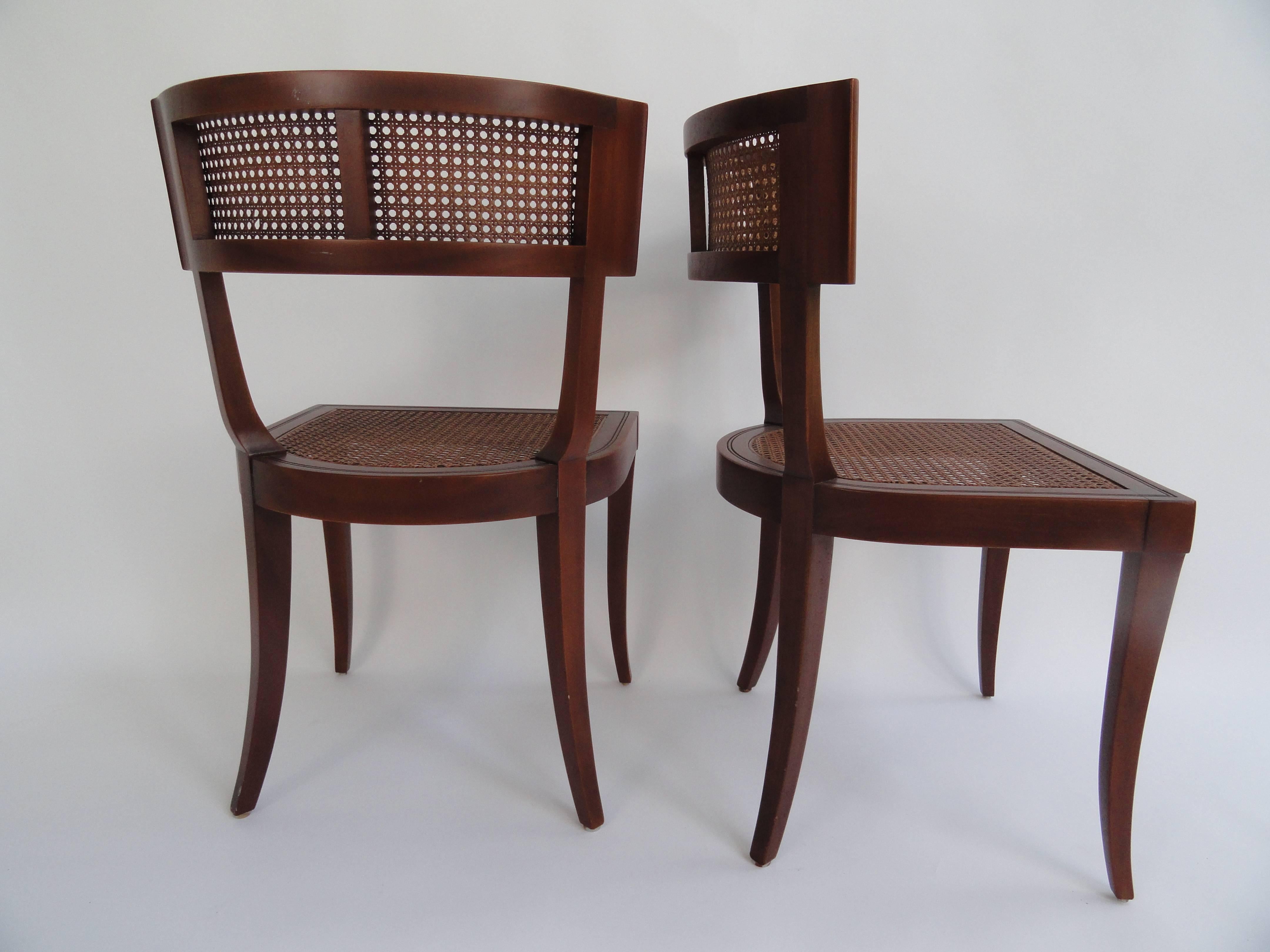Set of four T.H. Robsjohn-Gibbings Klismos style cane side chairs. Newly caned and refinished.