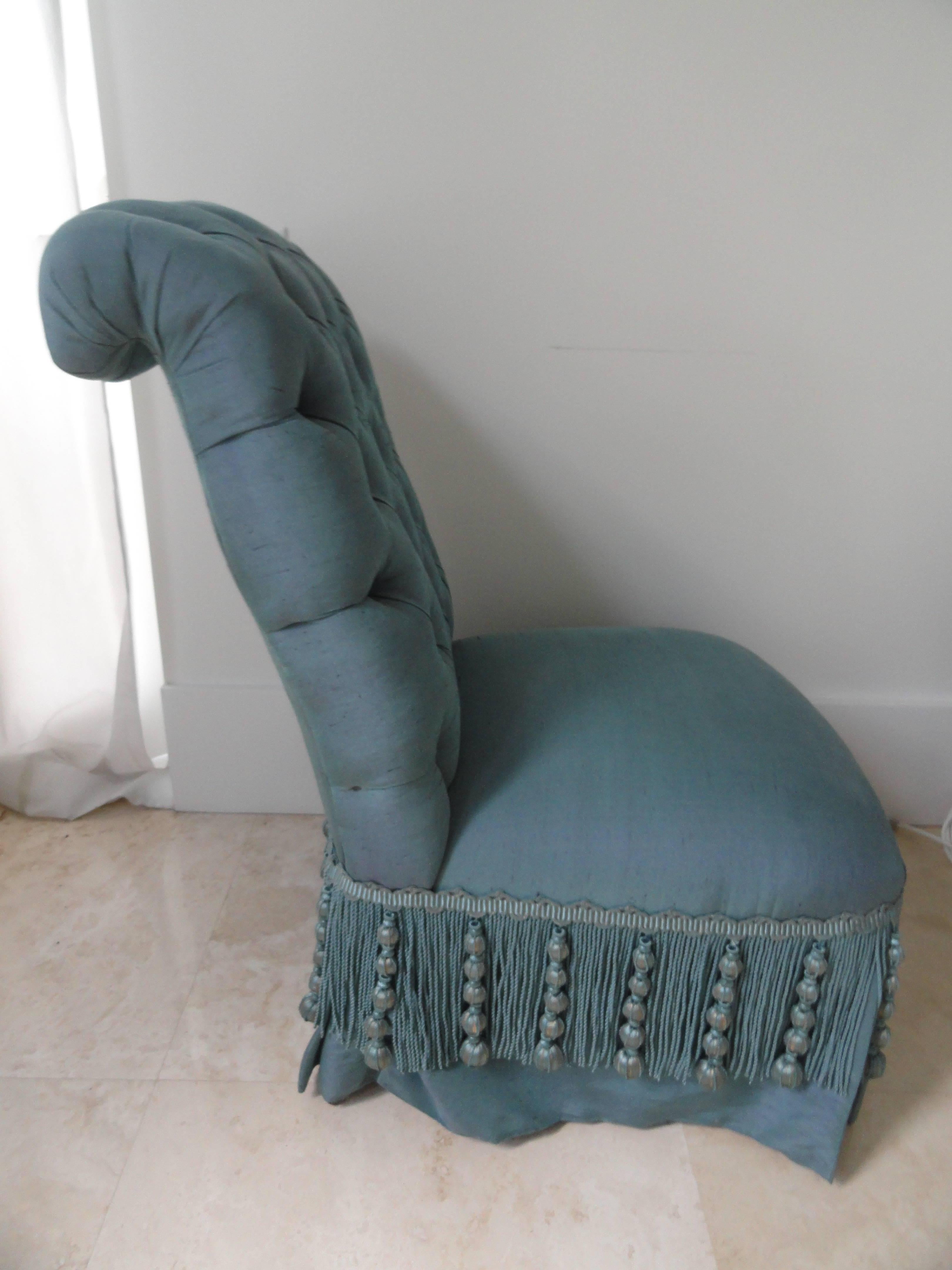 19th century French Napoleon III slipper chair with a tufted back, beautifully upholstered in Henry Calvin Athena Taffeta with a superb decorative fringe. Chair has sabot.