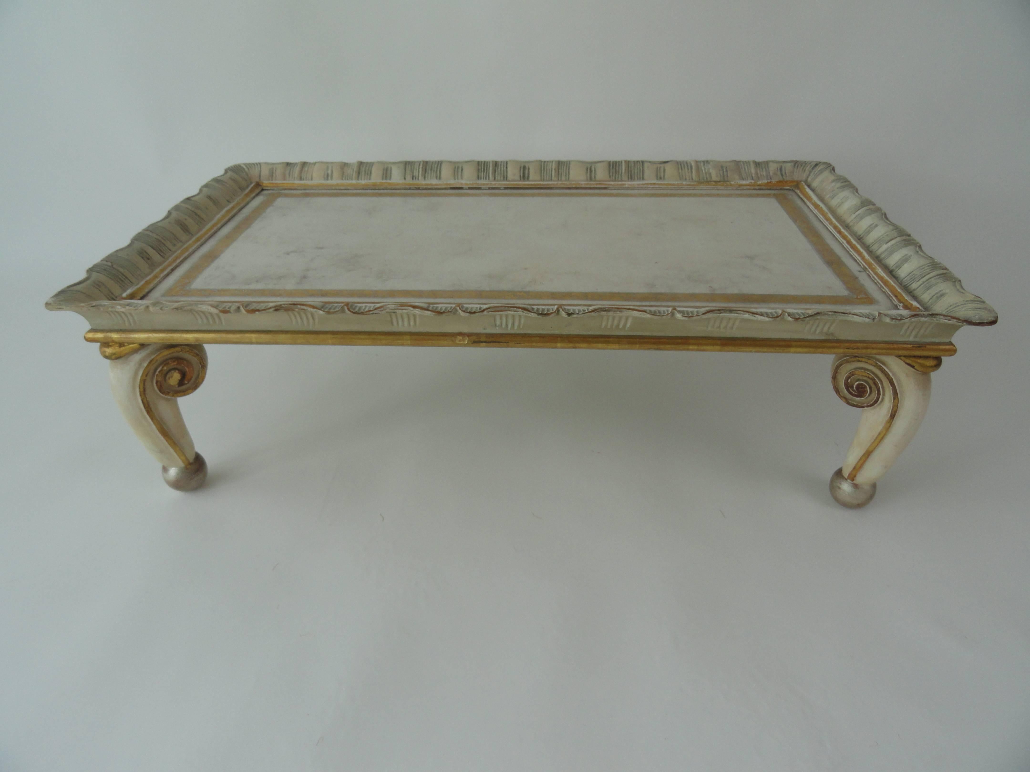 Signed and numbered Maison Jansen tray, circa 1952.
Wood carved tray table with original paint, gilt and tooled leather top. Wear consistent with age.
Very rare and unusual.
Measures: 35