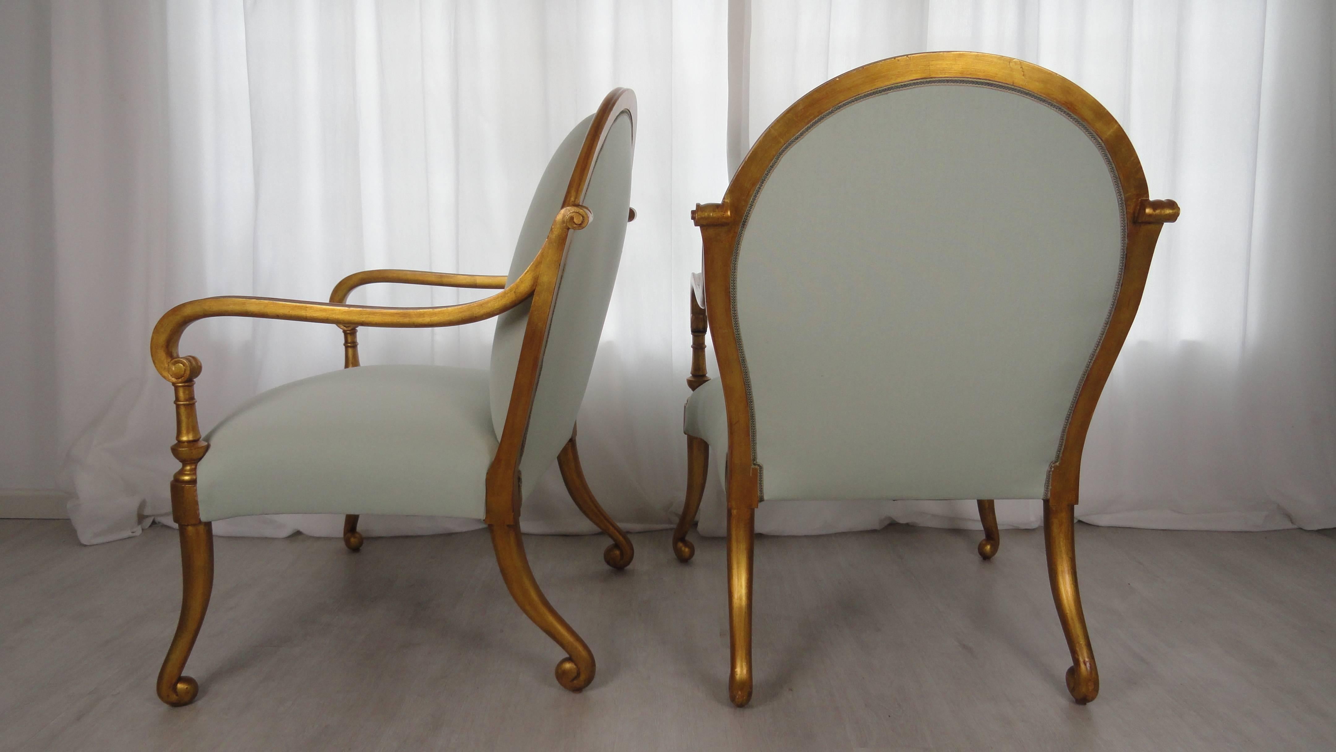 Pair of Rose Tarlow Melrose House Verona armchairs. Large-scale armchairs with tight seat and back. All hand-carved frame covered in 22-carat gold. Chairs have been upholstered in Holly Hunt indoor/outdoor celadon. Excellent condition.