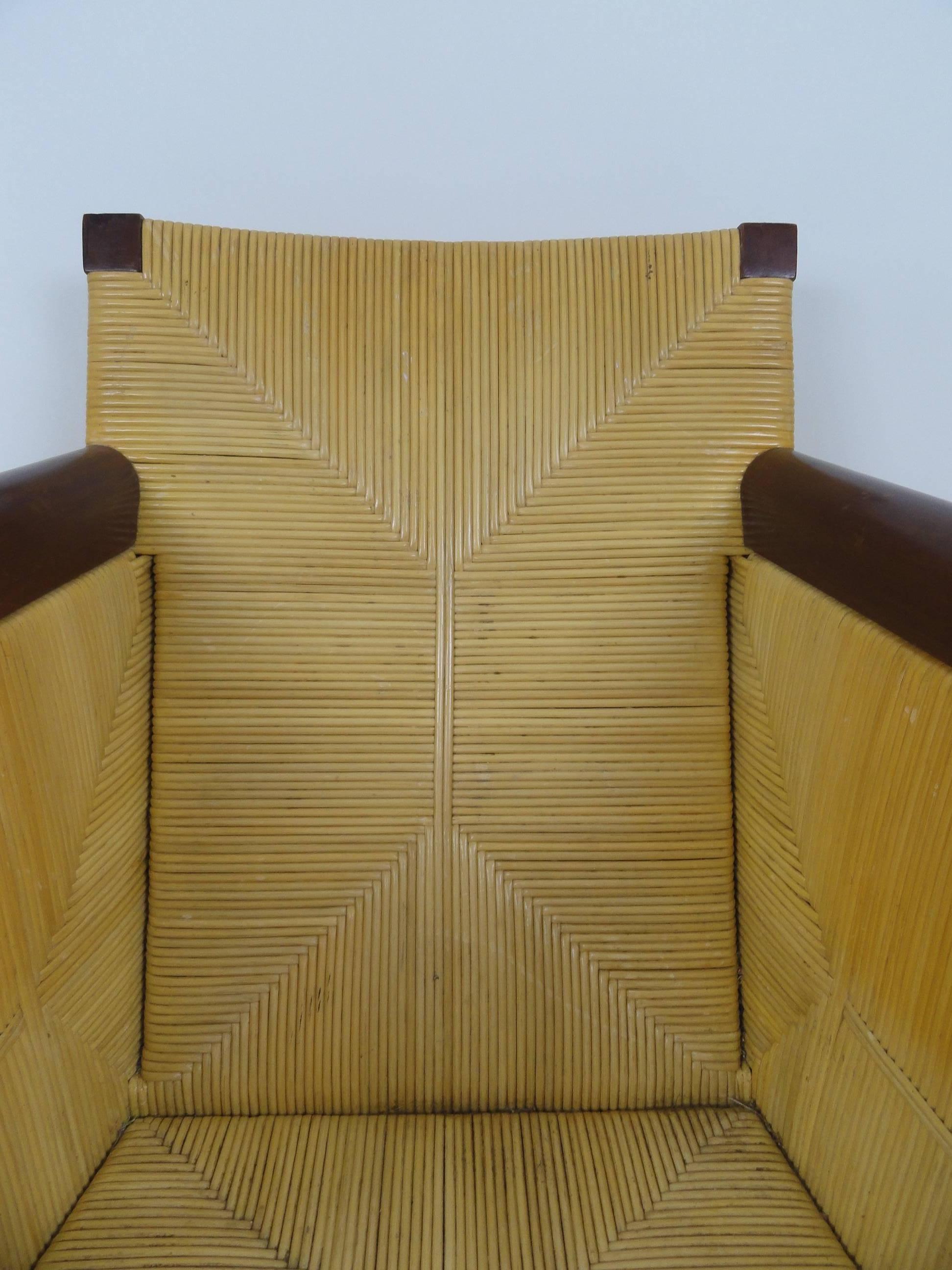 John Hutton club chair for the Donghia Berbau Collection. Contemporary lounge chair made of wicker and wood. No cushions.
This chair is a rare find and demonstrated original design by John Hutton.