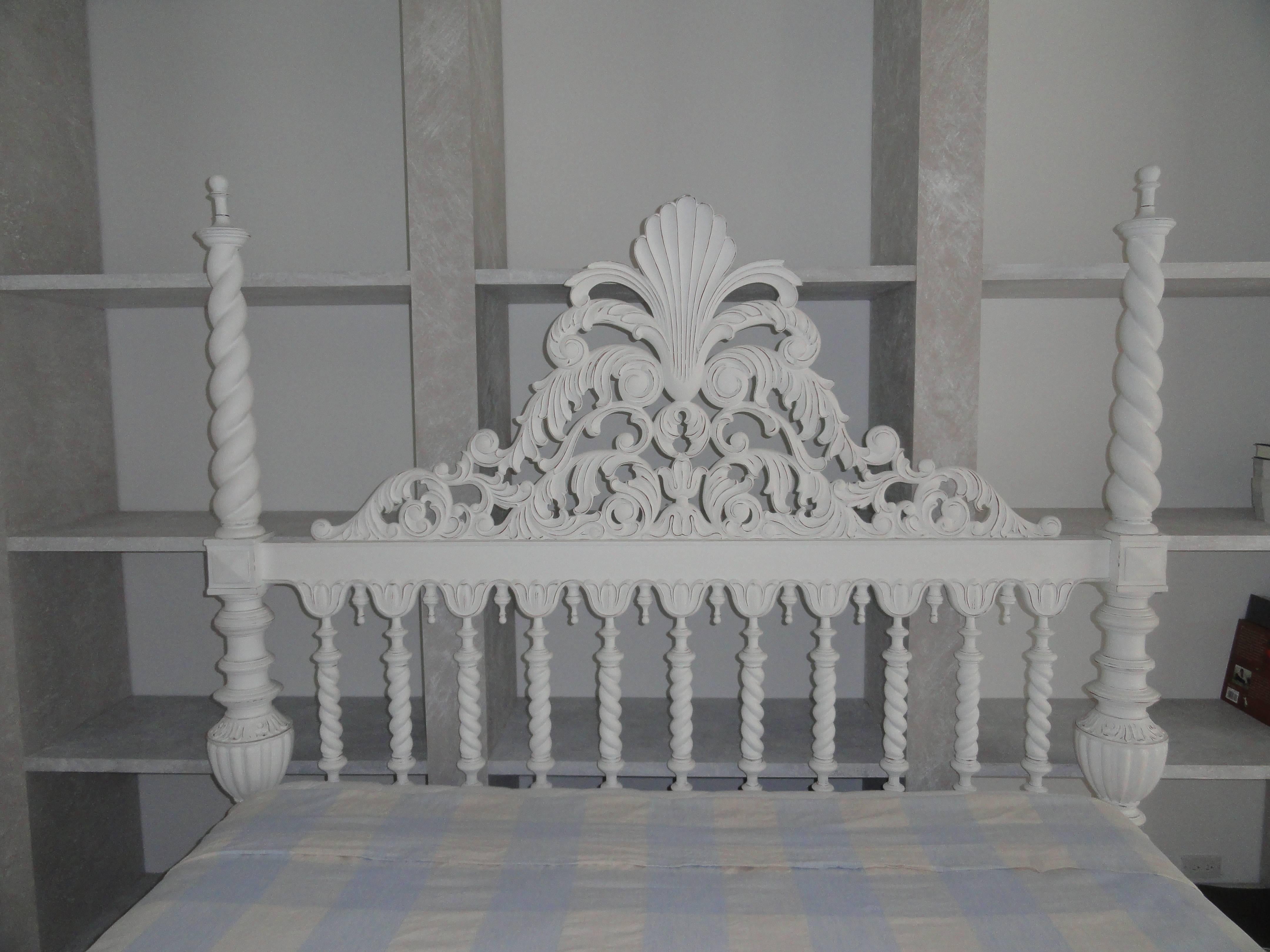 King-size plantation style four-poster wood bed. Head board features twist columns with an elegant carved cartouche. Four posters are carved wood in a twist pattern. Beautiful detail on the base of bed.
Custom white painted finish. Bed frame only.