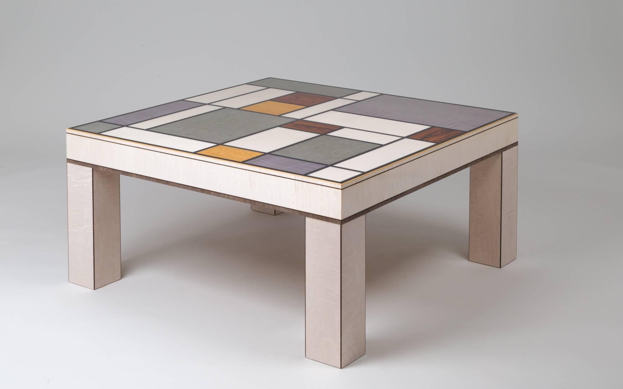 This most vibrant coffee table showcases an impressive array of colourful veneers. Beeswing satinwood, maple, kingwood and various sycamores link together in a well-balanced montage.
Our designer took his inspiration from the artist Mondrian, a