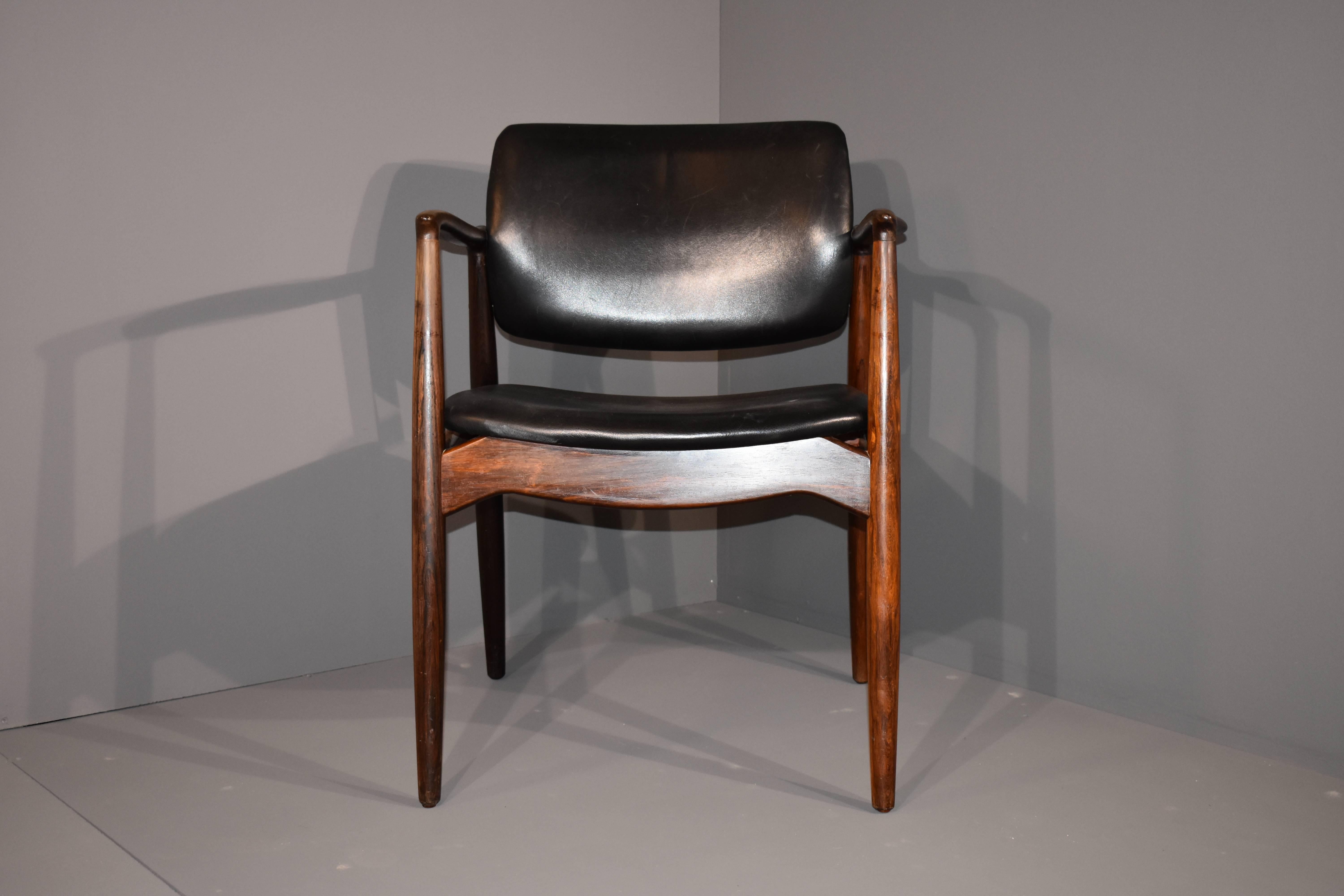 A rosewood armchair designed by Erik Buch.
Black leather upholstery.