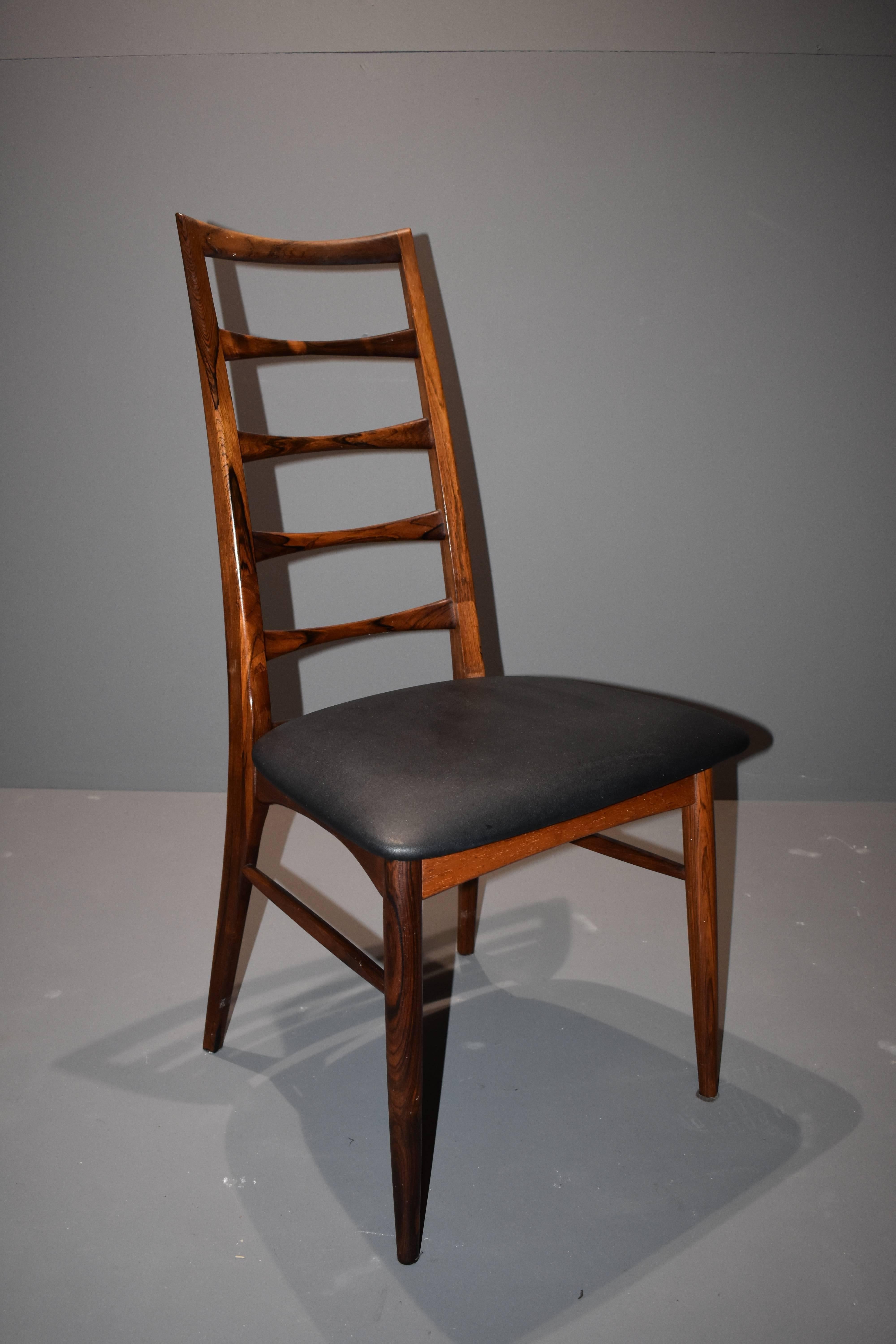 Set of six beautíful rosewood chairs designed by Niels Kofod Larsen.
Upholstery in original back leather.