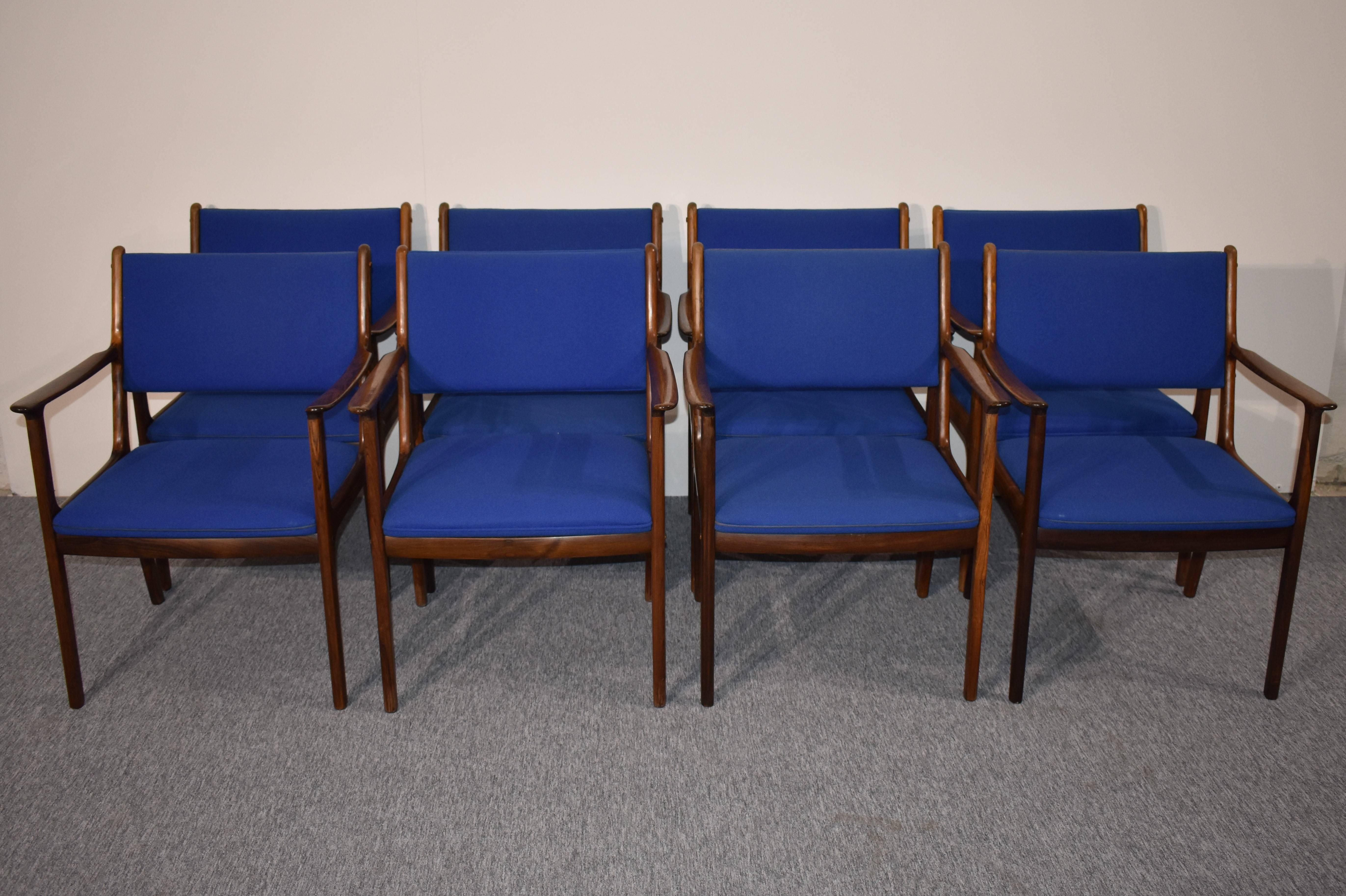 
Set of eight beautiful rare palisander armchairs, designed Danish furniture designer by Ole Wanscher for Poul Jeppesen. The chairs have blue upholstery. From 1950s.