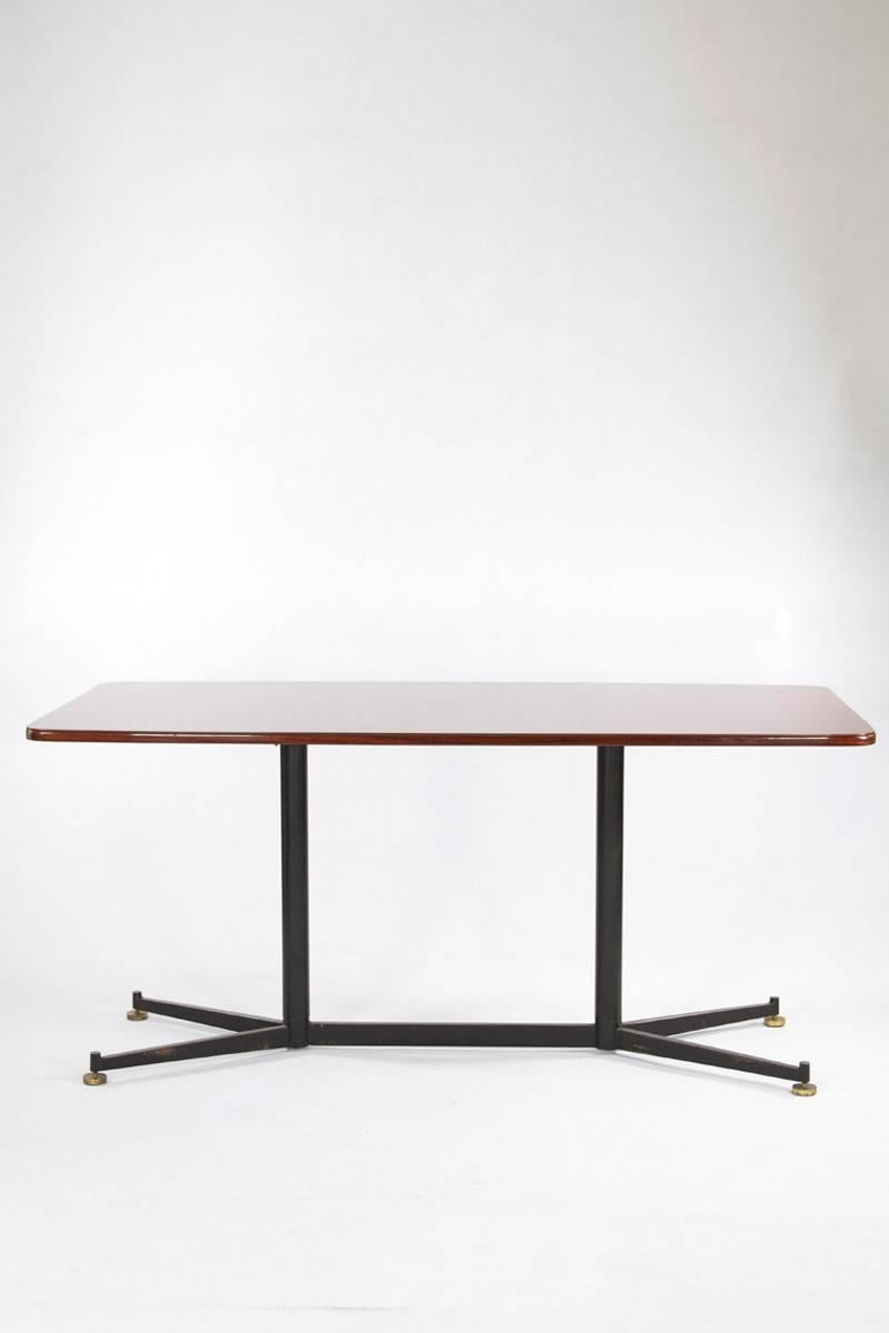Italian dining rosewood table with aubergine glasstop and black steel legs.
