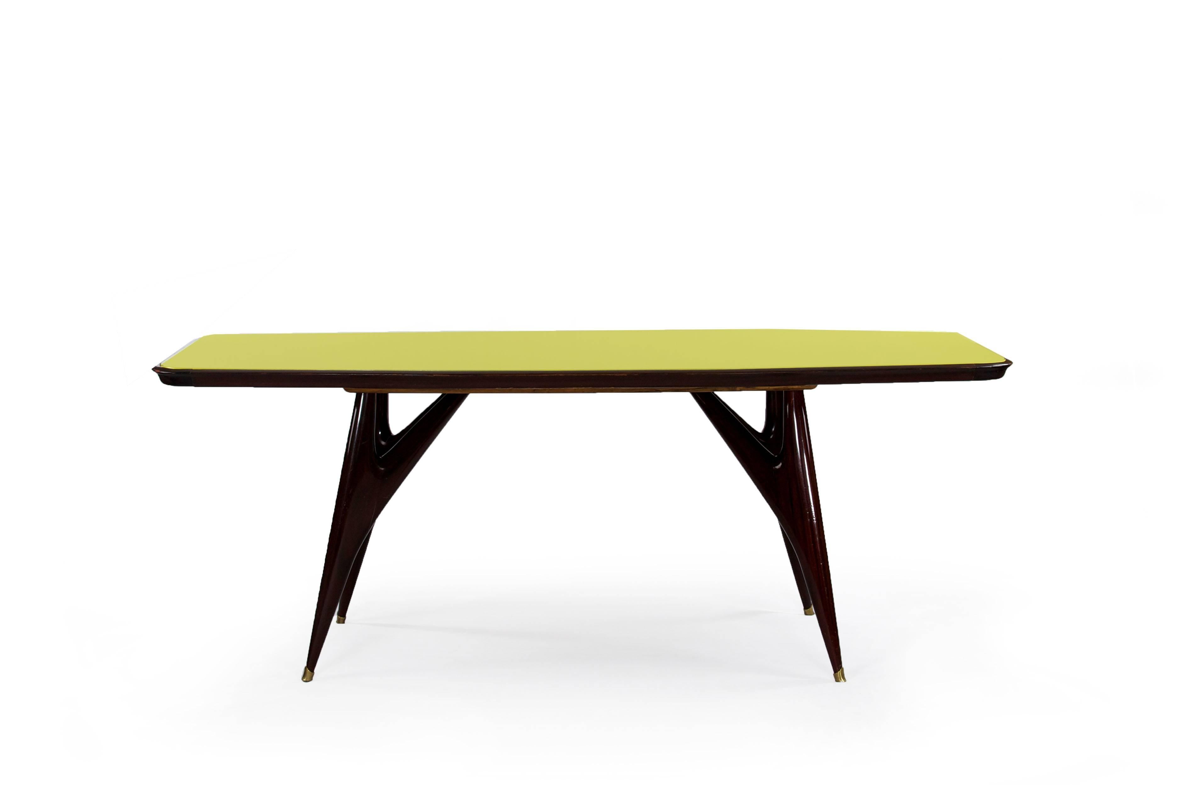Rosewood dining table with a yellow colored glasstop, Italy, 1950s.