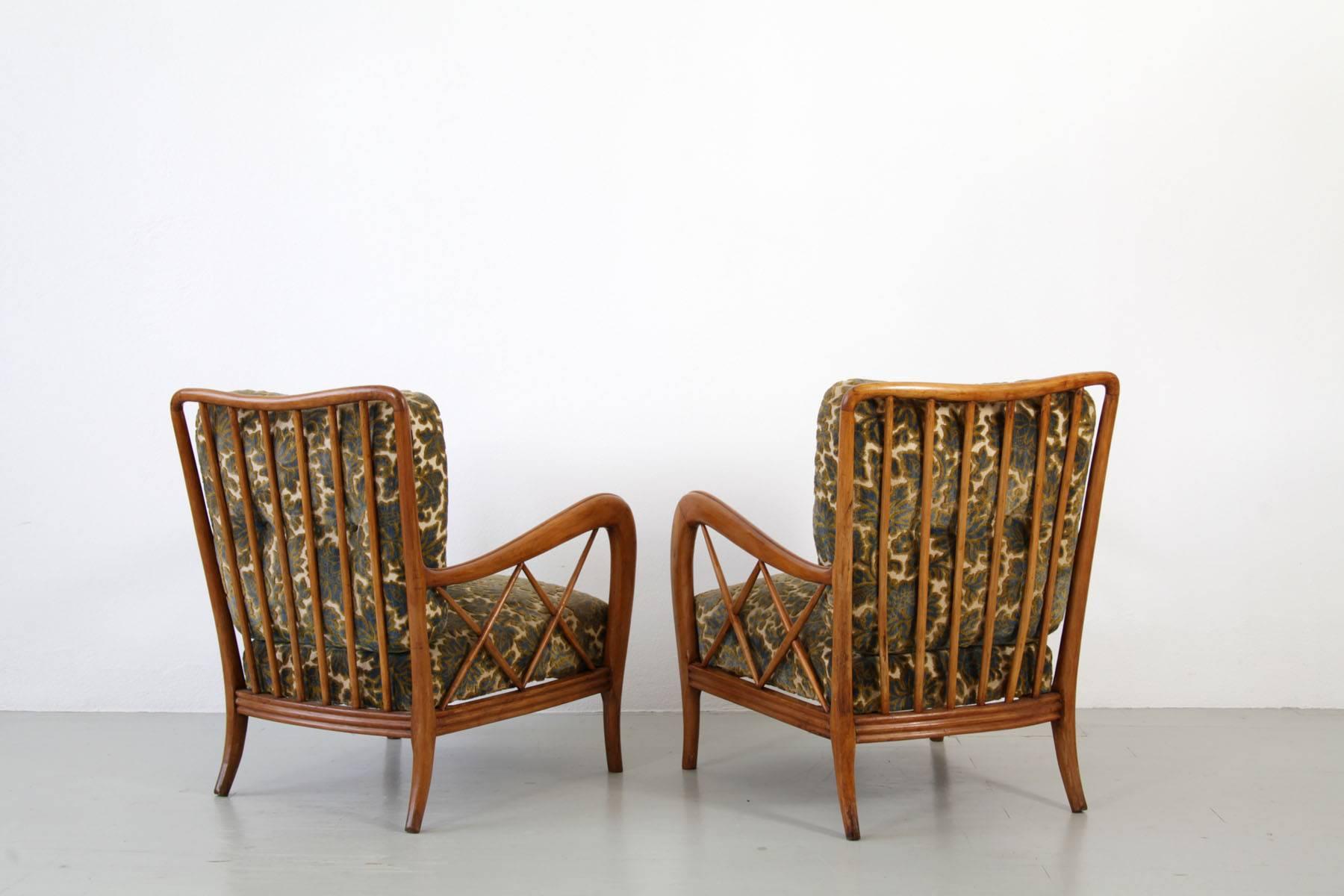 Set of 2 authentic Italian armchairs with footstools from the 1940s from Paolo Buffa. Armchair is made of a structure of cherry wood and a floral patterned upholstery in good original condition.

