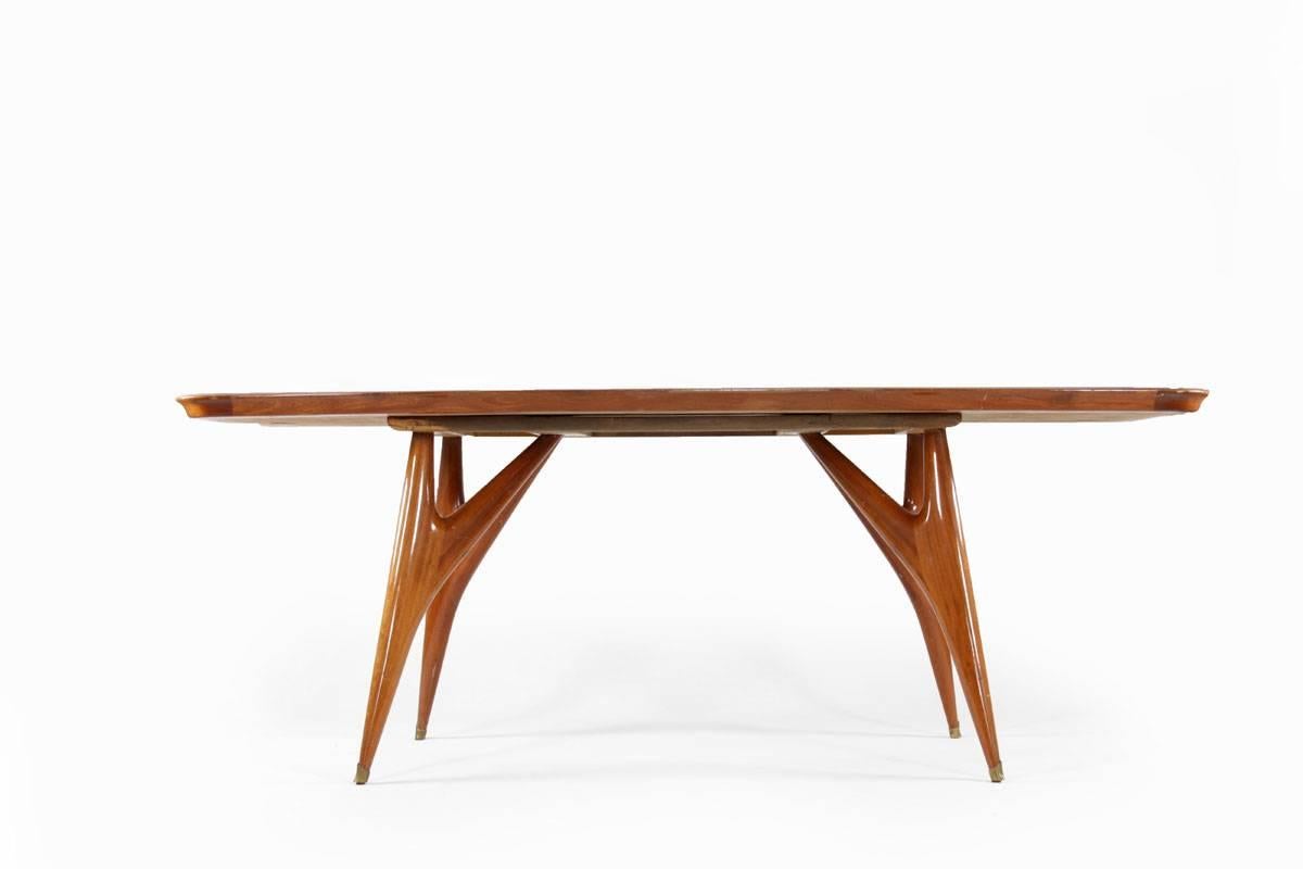 Dining table designed by Vittorio Dassi, Italy, 1950s. The table has a copper colored glass top and brass fittings on a wooden body.
Feel free to contact us for more detailed pictures.