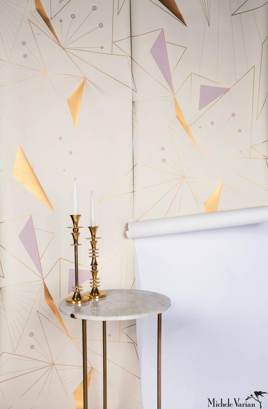 This modern, and geometric wallpaper adds graphic warmth and texture to your walls in a soft color palette of metallic bronze/gold, light lilac and off-white. It works well with Mid-Century Modern, Hollywood Regency, Art Deco and contemporary