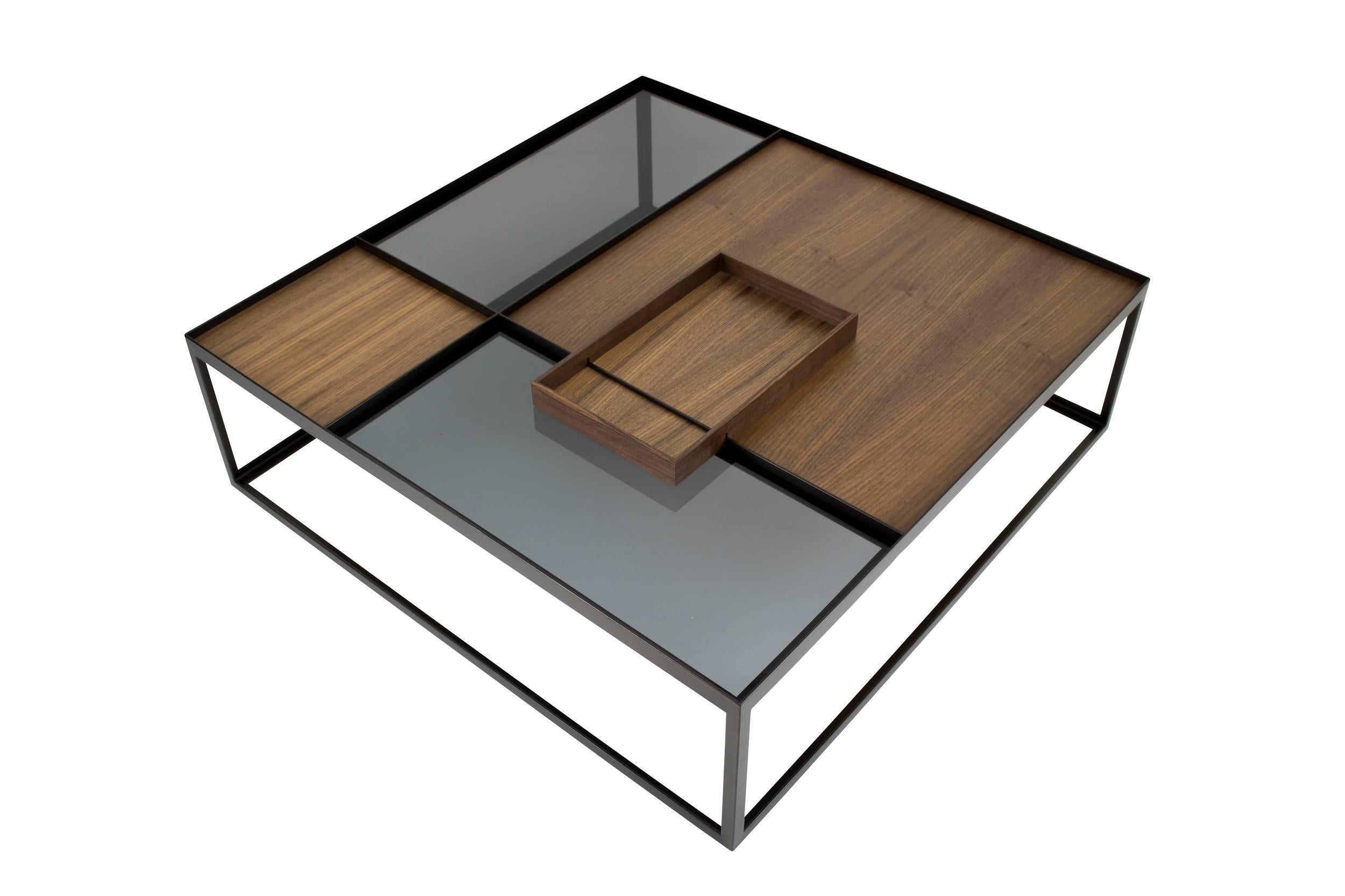 The Q4 coffee table is a reminiscence to the conceptualism De Stijl and equally inspired by minimalistic architecture.
Different valuable materials combined with a filigree steel frame shaping the elegant minimalistic appearance.
The removable and