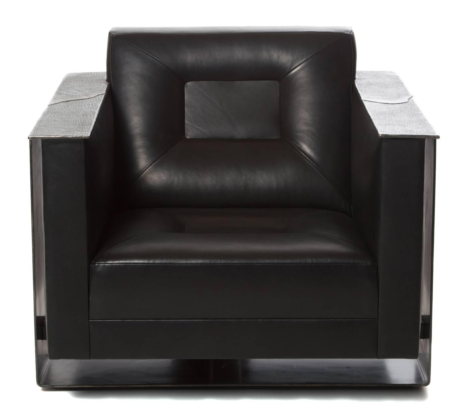 Domito club chair, upholstered leather cast bronze armrests steel contemporary American lounge chair.

The Domito club chair is pictured in Full Aniline black leather. It is also available in fifteen other Full Aniline leather color options. Also