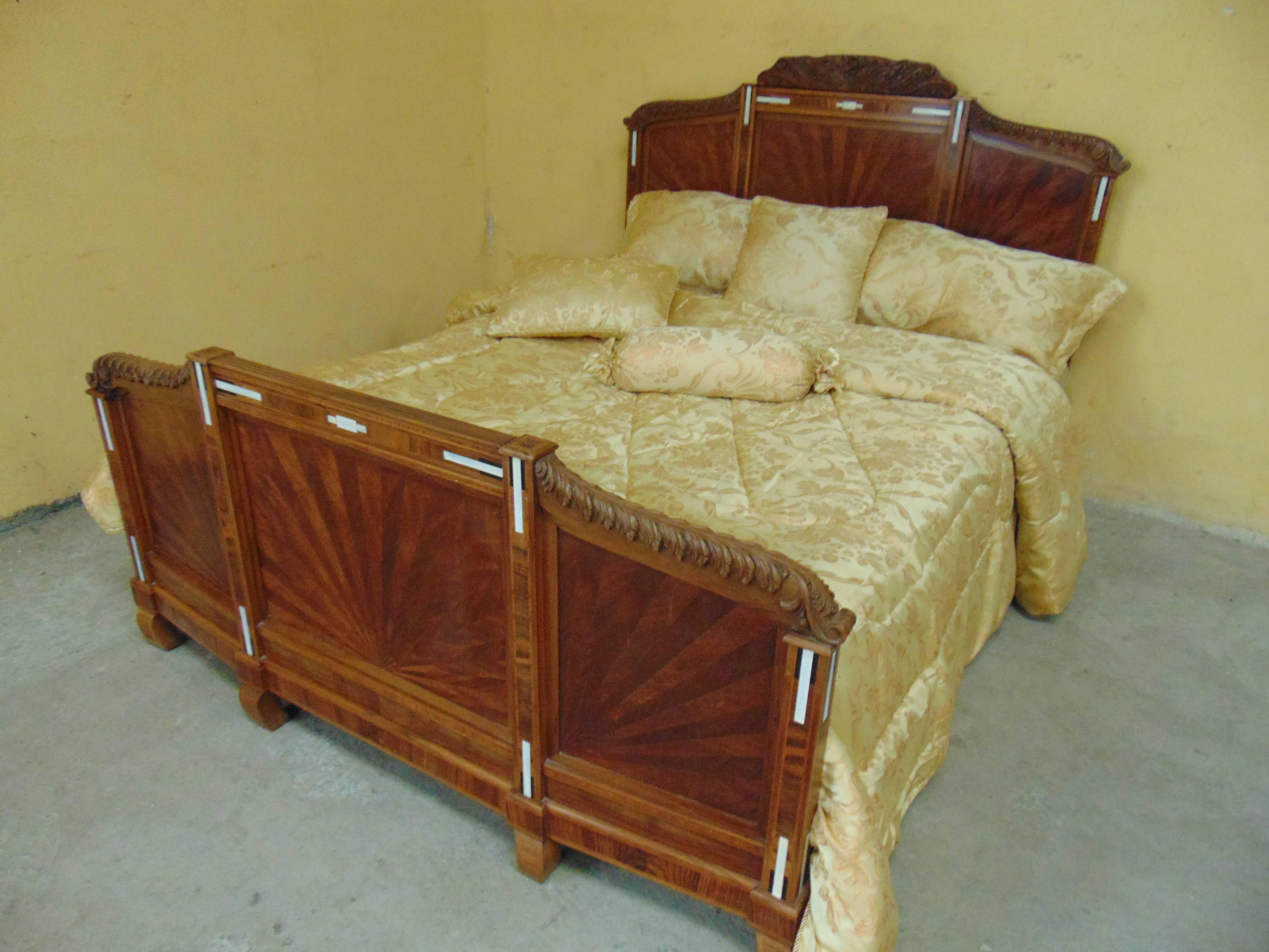 An exceptionally fine solid walnut Art Deco bedroom suite, circa 1930 inlaid with specimen woods and faux bone, the quality of cabinetwork and hand carving is of the best. This fine and important suite was undoubtedly custom-made to order and is