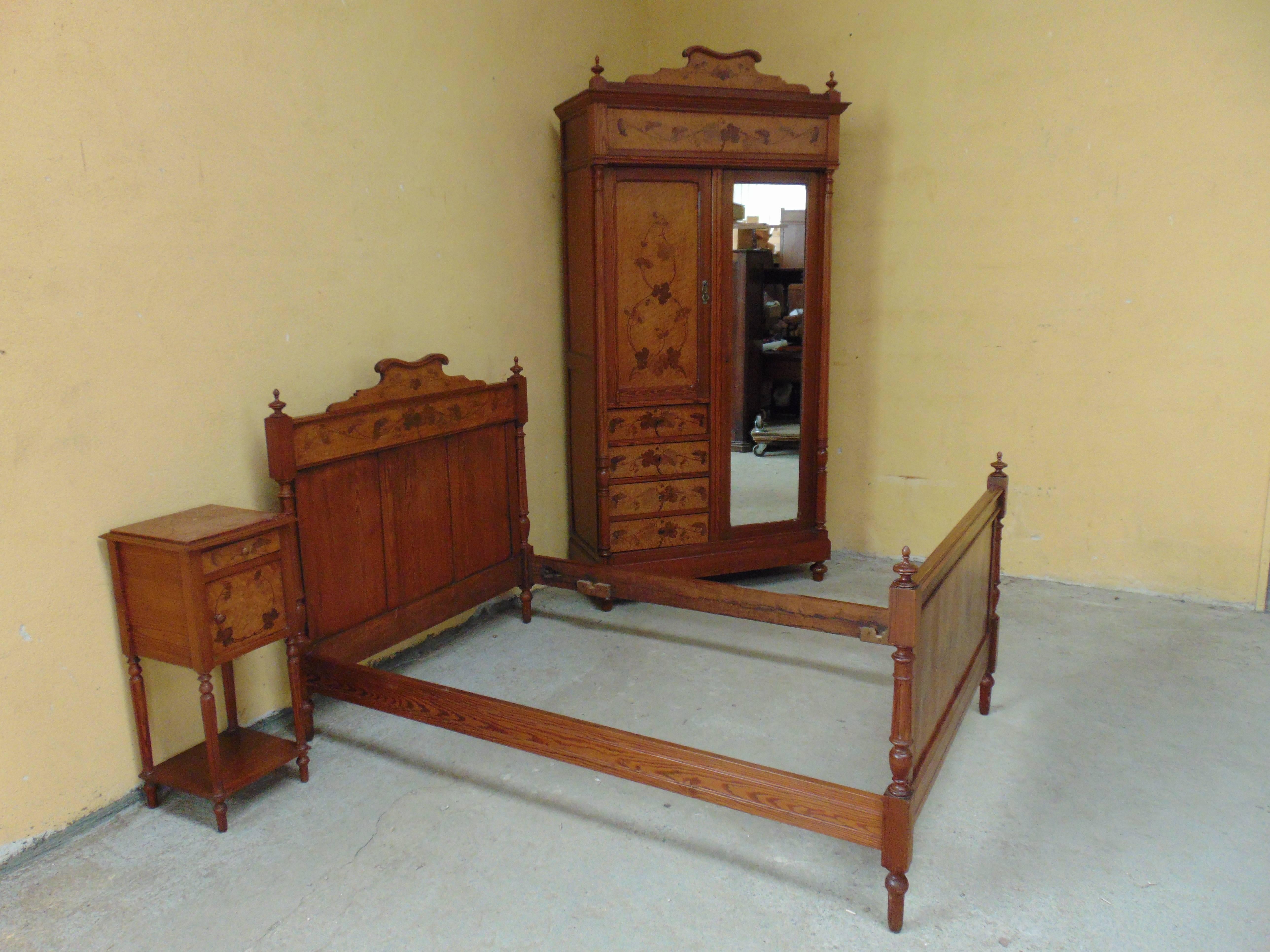 This charming and beautiful suite made in the Art Nouveau style circa 1910 will be perfect for a single person or child. With marquetry inlay in, harewood, bird's-eye maple, box and other fine woods. 
Consisting of bed, armoire and bedside cabinet